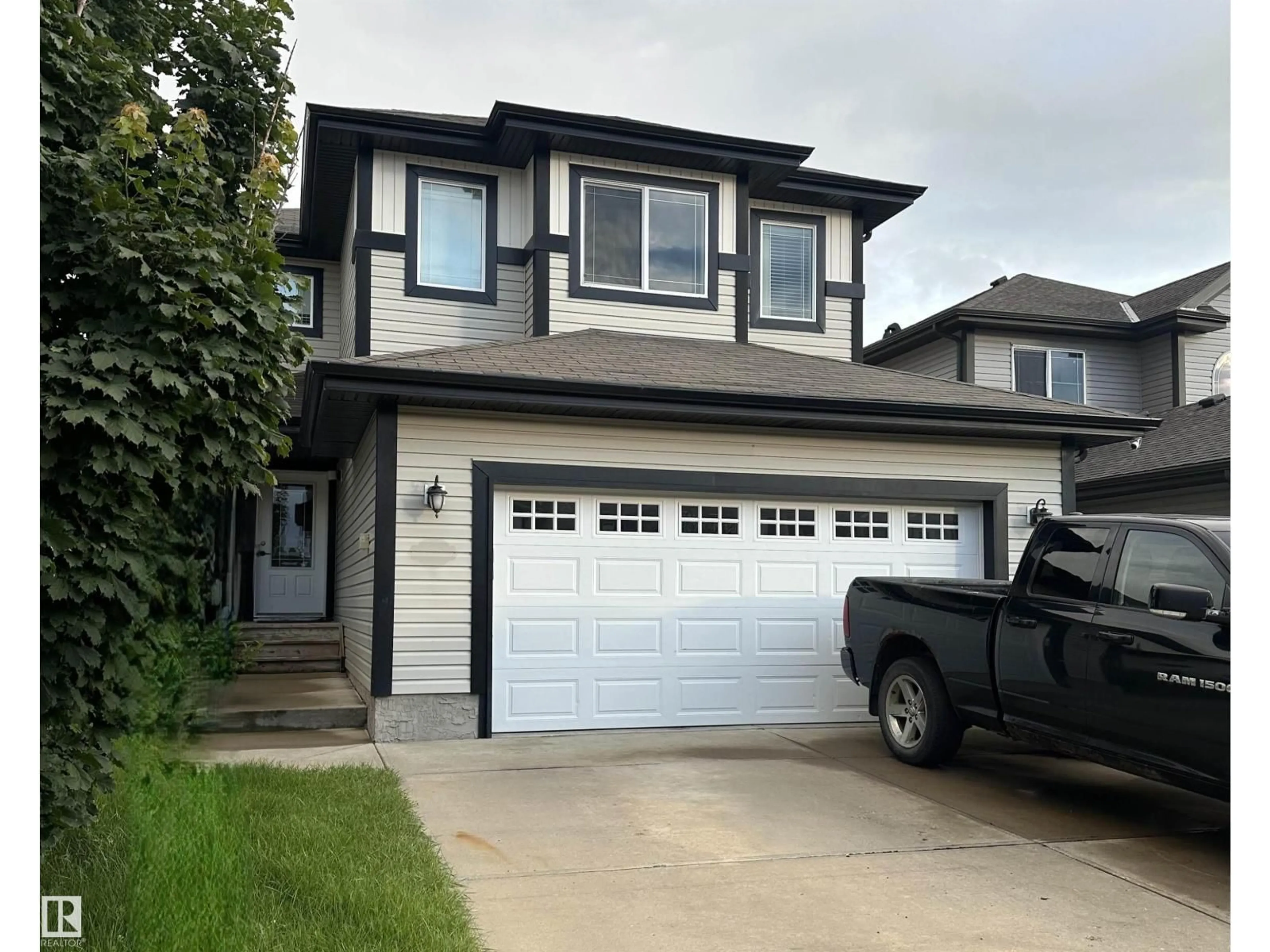 Home with vinyl exterior material, street for 178 WOODBEND WY, Fort Saskatchewan Alberta T8L4S4