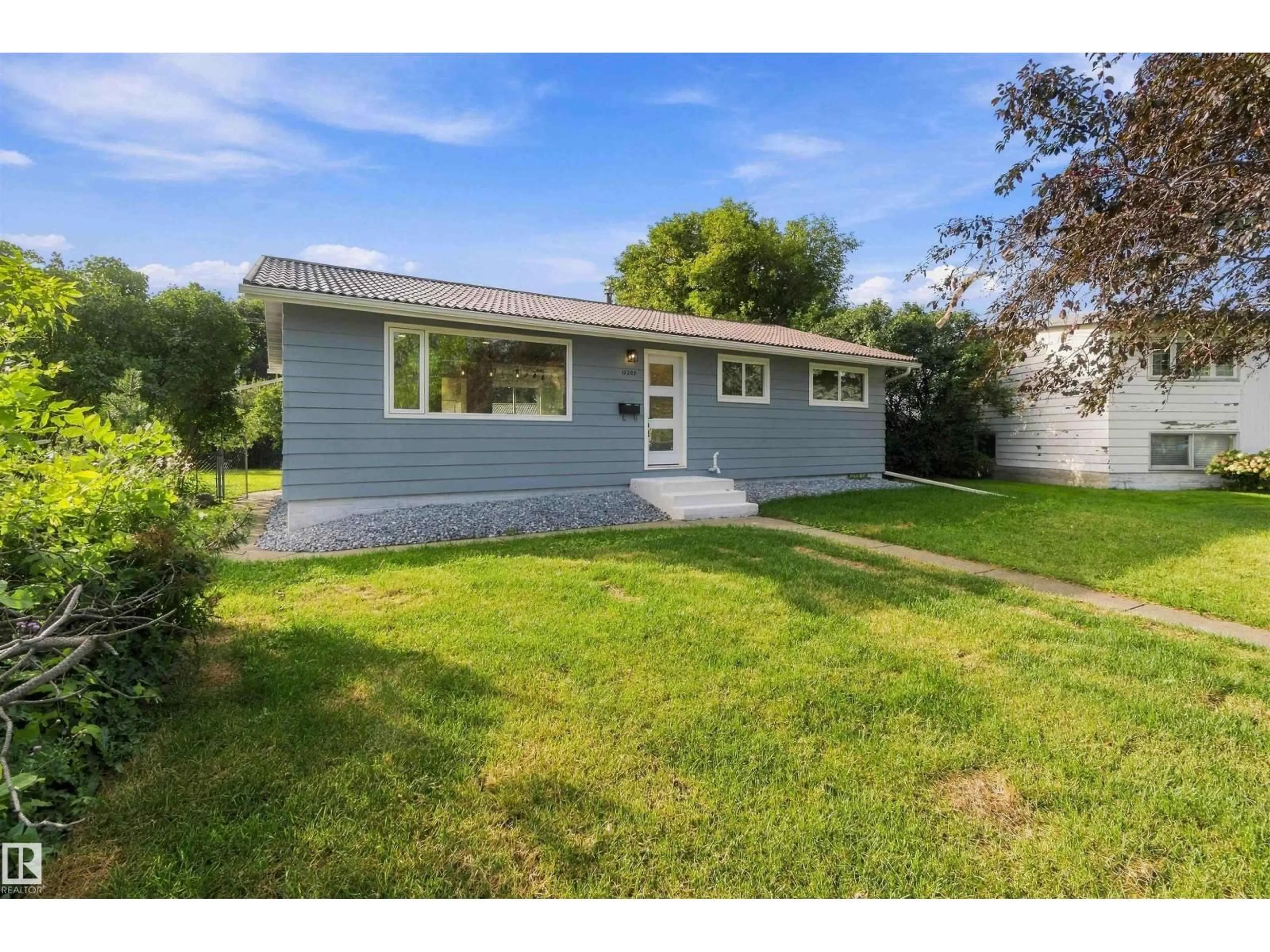 Home with vinyl exterior material, street for NW - 13203 136A AV, Edmonton Alberta T5L4B7