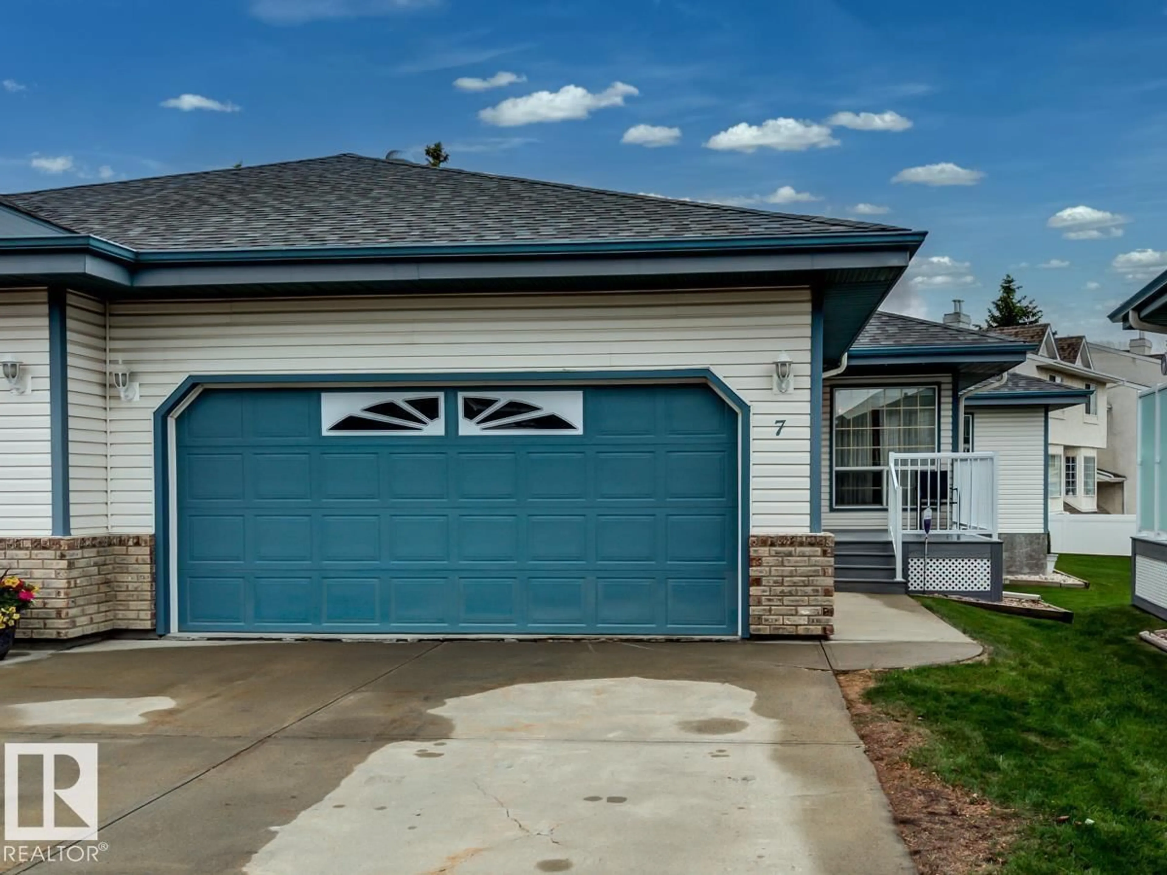 Home with vinyl exterior material, street for 7 - 9731 174 ST NW, Edmonton Alberta T5T6G4