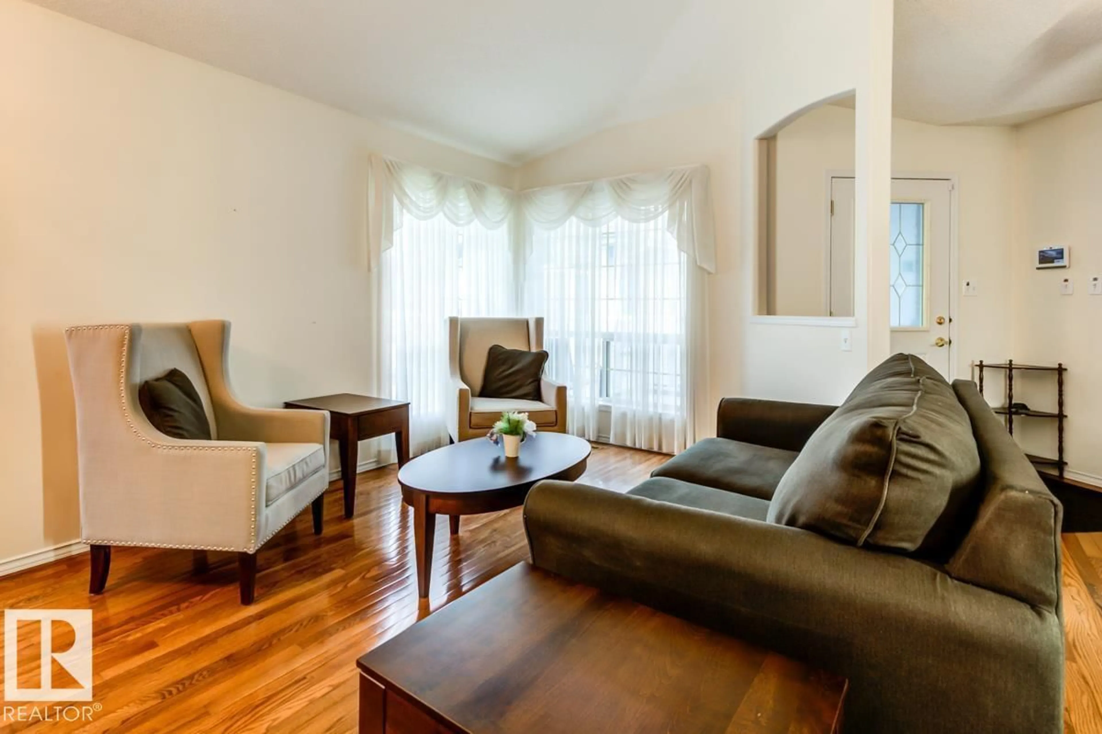 Living room with furniture, wood/laminate floor for 7 - 9731 174 ST NW, Edmonton Alberta T5T6G4