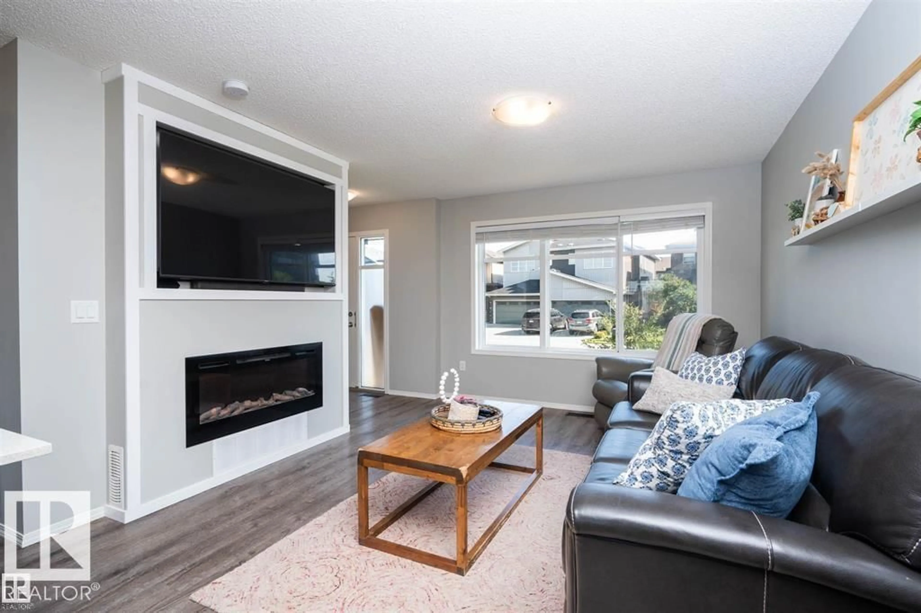 Living room with furniture, wood/laminate floor for 3040 CHECKNITA WY, Edmonton Alberta T6W3X8
