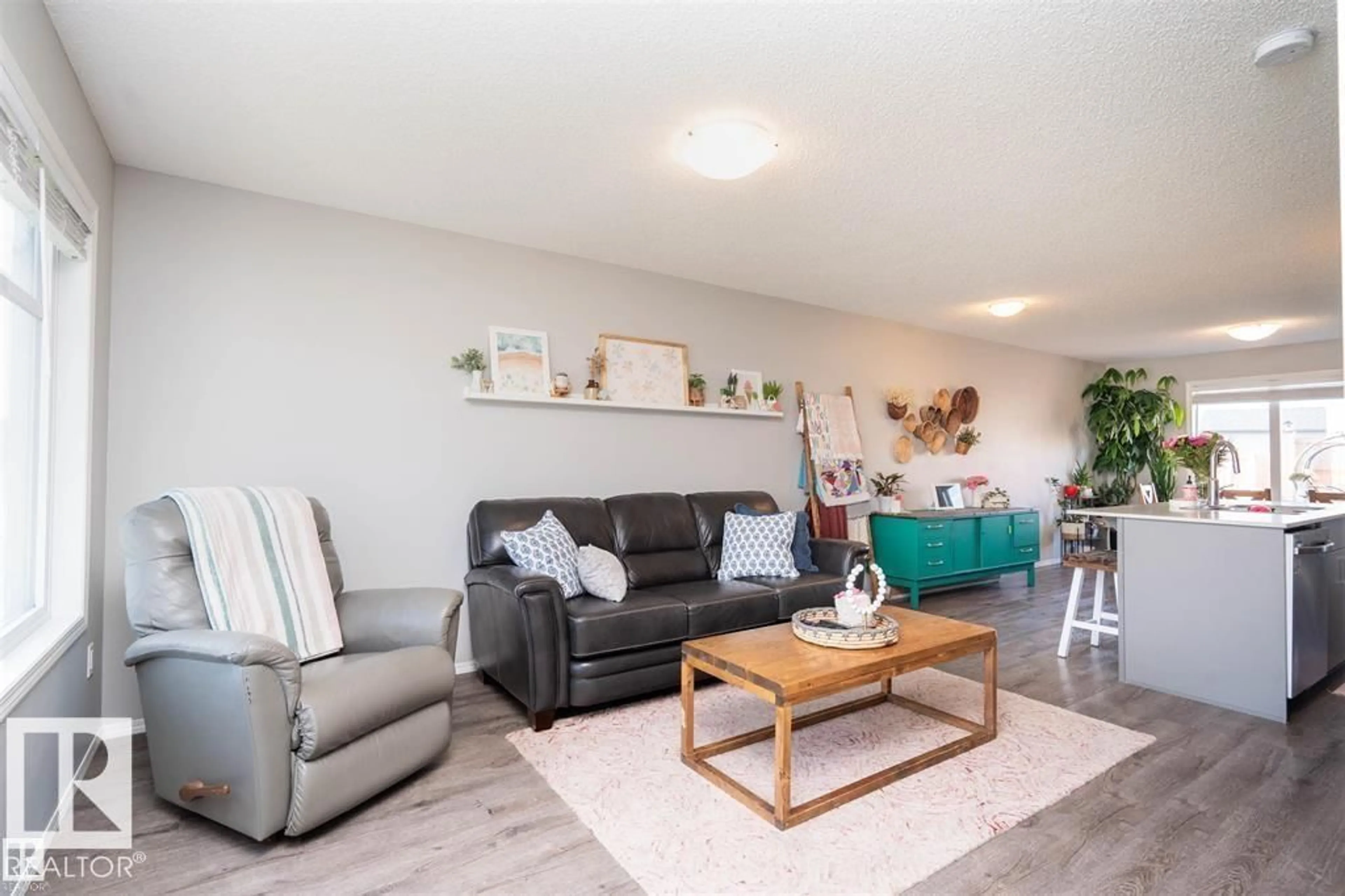 Living room with furniture, wood/laminate floor for 3040 CHECKNITA WY, Edmonton Alberta T6W3X8