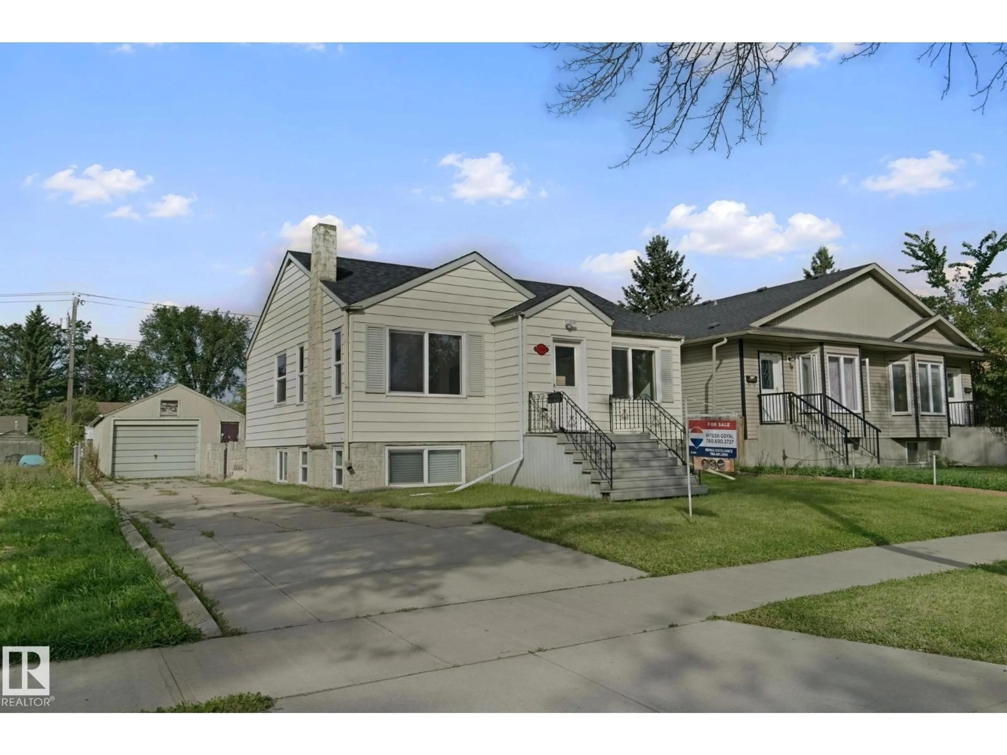 Home with vinyl exterior material, street for 11914 124 ST, Edmonton Alberta T5L0M5
