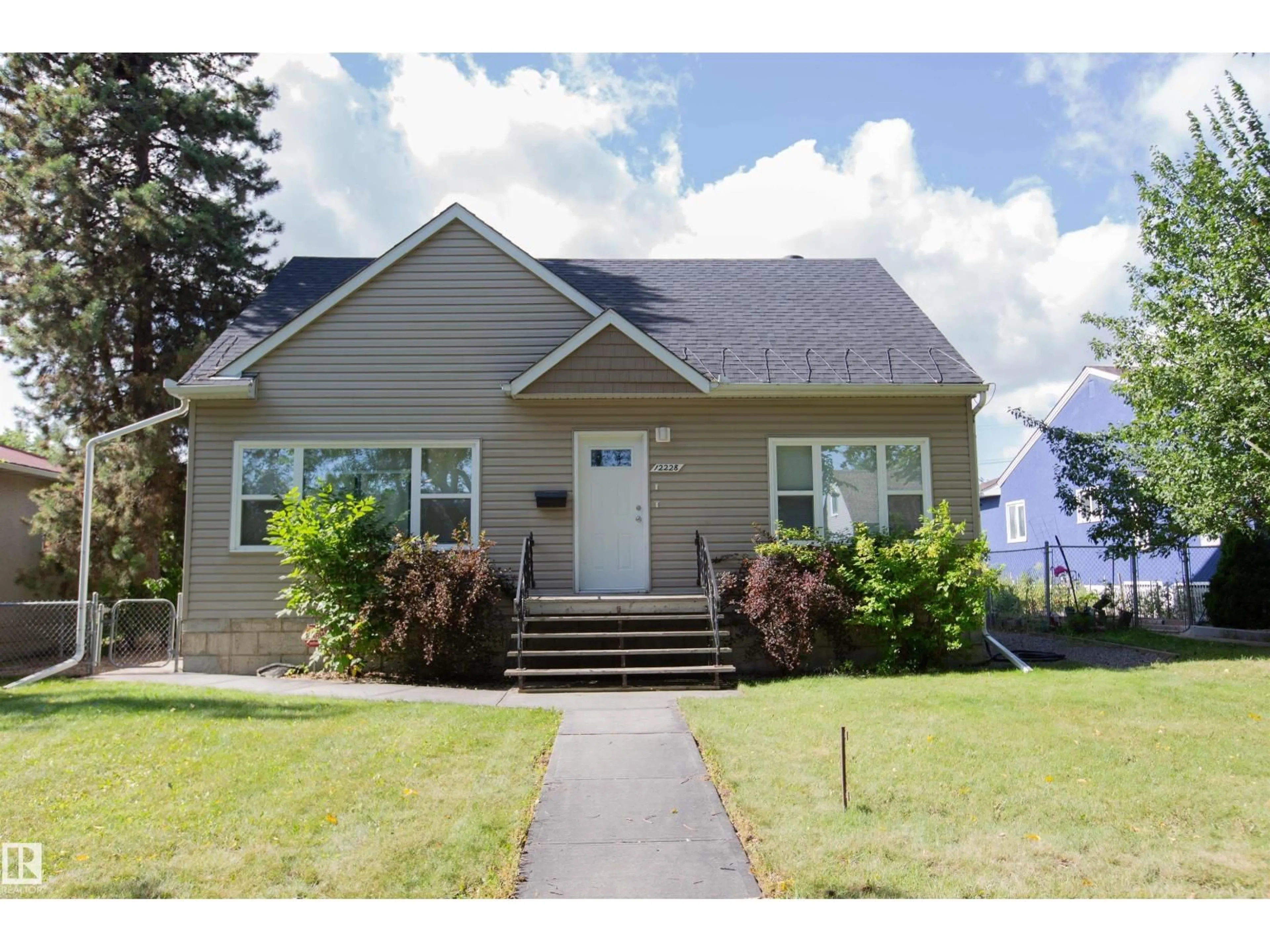 Home with vinyl exterior material, street for NW - 12228 134 ST, Edmonton Alberta T5L1T7