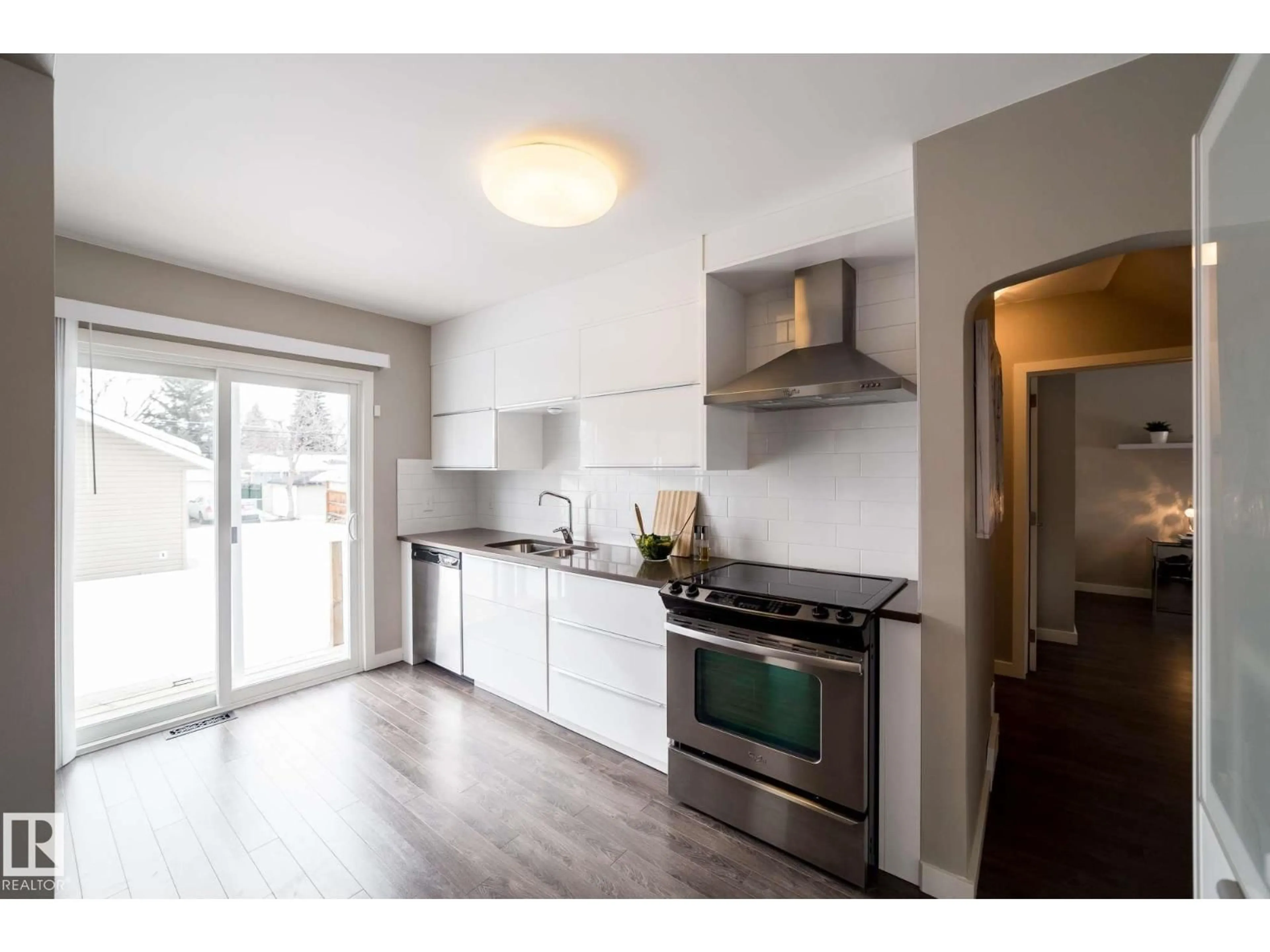 Open concept kitchen, wood/laminate floor for NW - 12228 134 ST, Edmonton Alberta T5L1T7