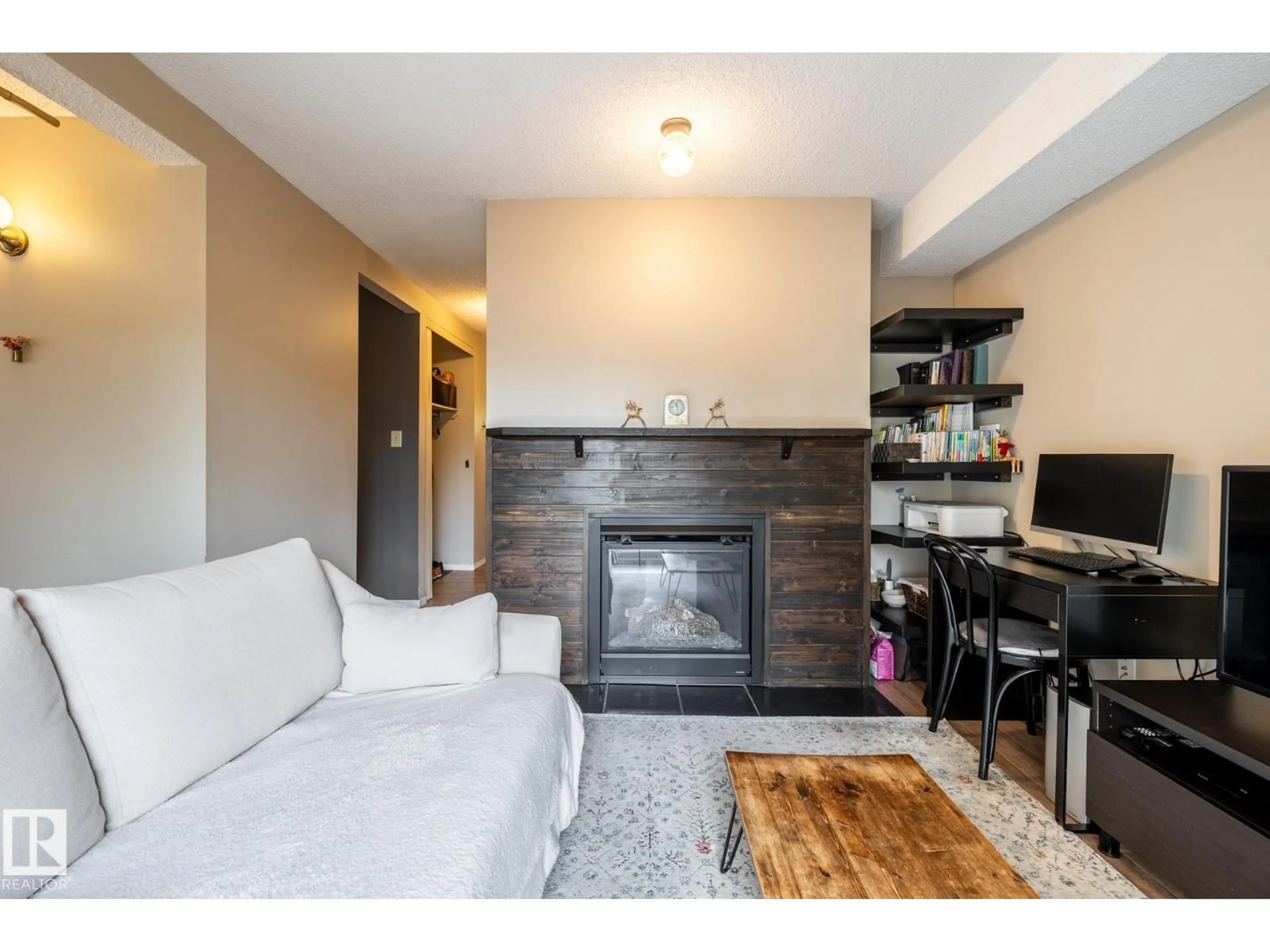Living room with furniture, wood/laminate floor for 20 3812 20 AV NW, Edmonton Alberta T6L4B2