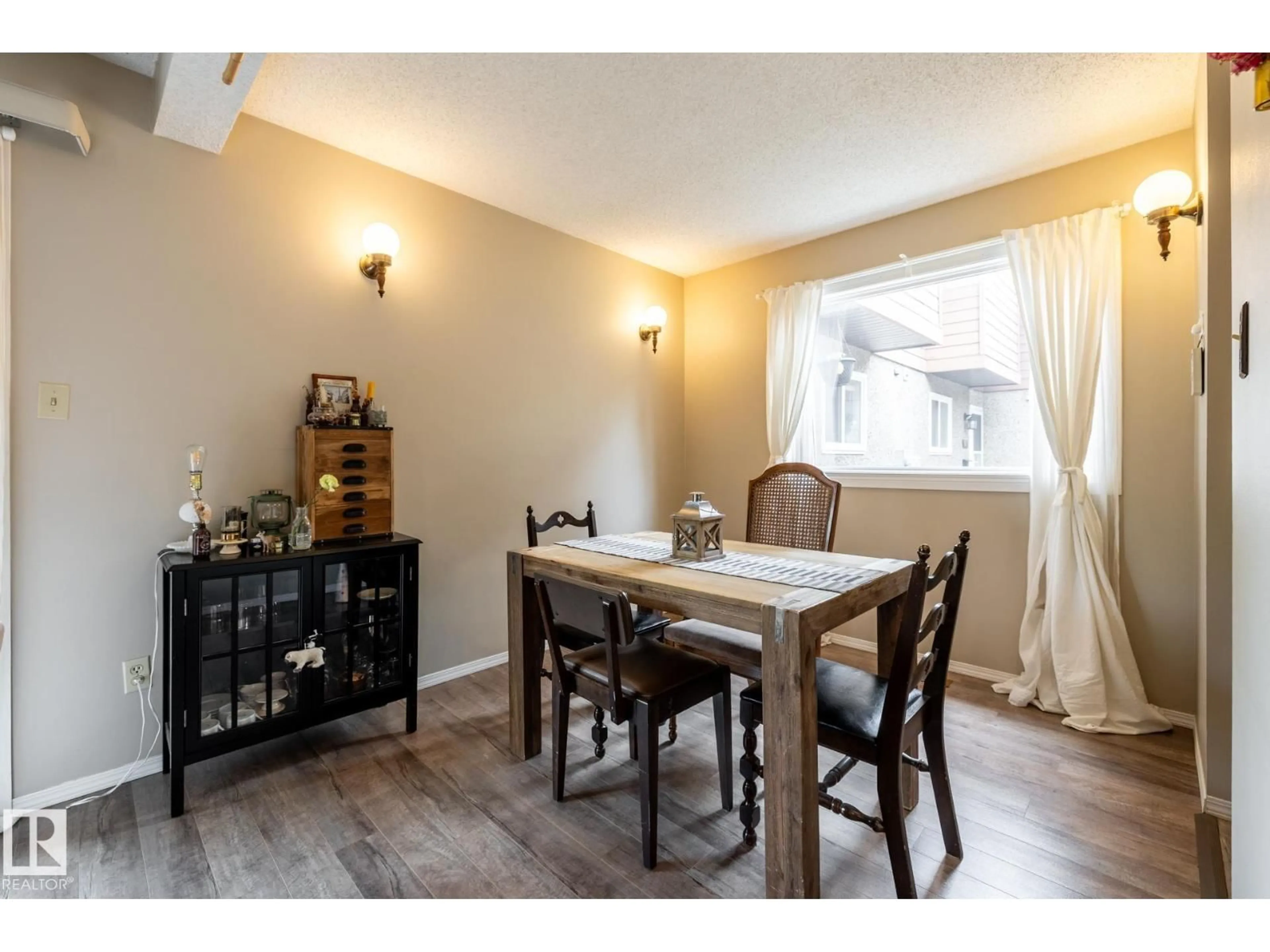 Dining room, wood/laminate floor for 20 3812 20 AV NW, Edmonton Alberta T6L4B2