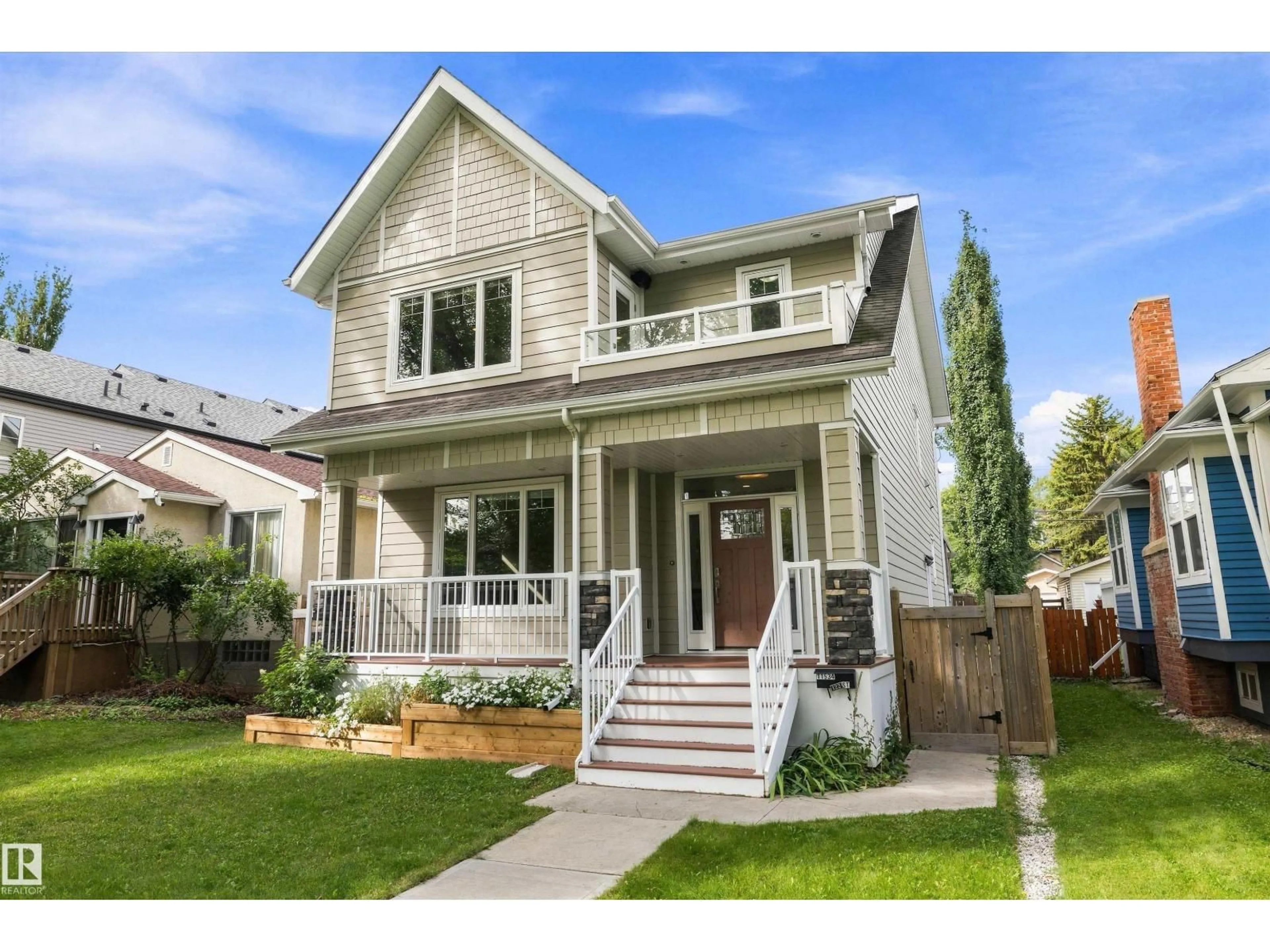Home with vinyl exterior material, street for NW - 11534 122 ST, Edmonton Alberta T5M0C1