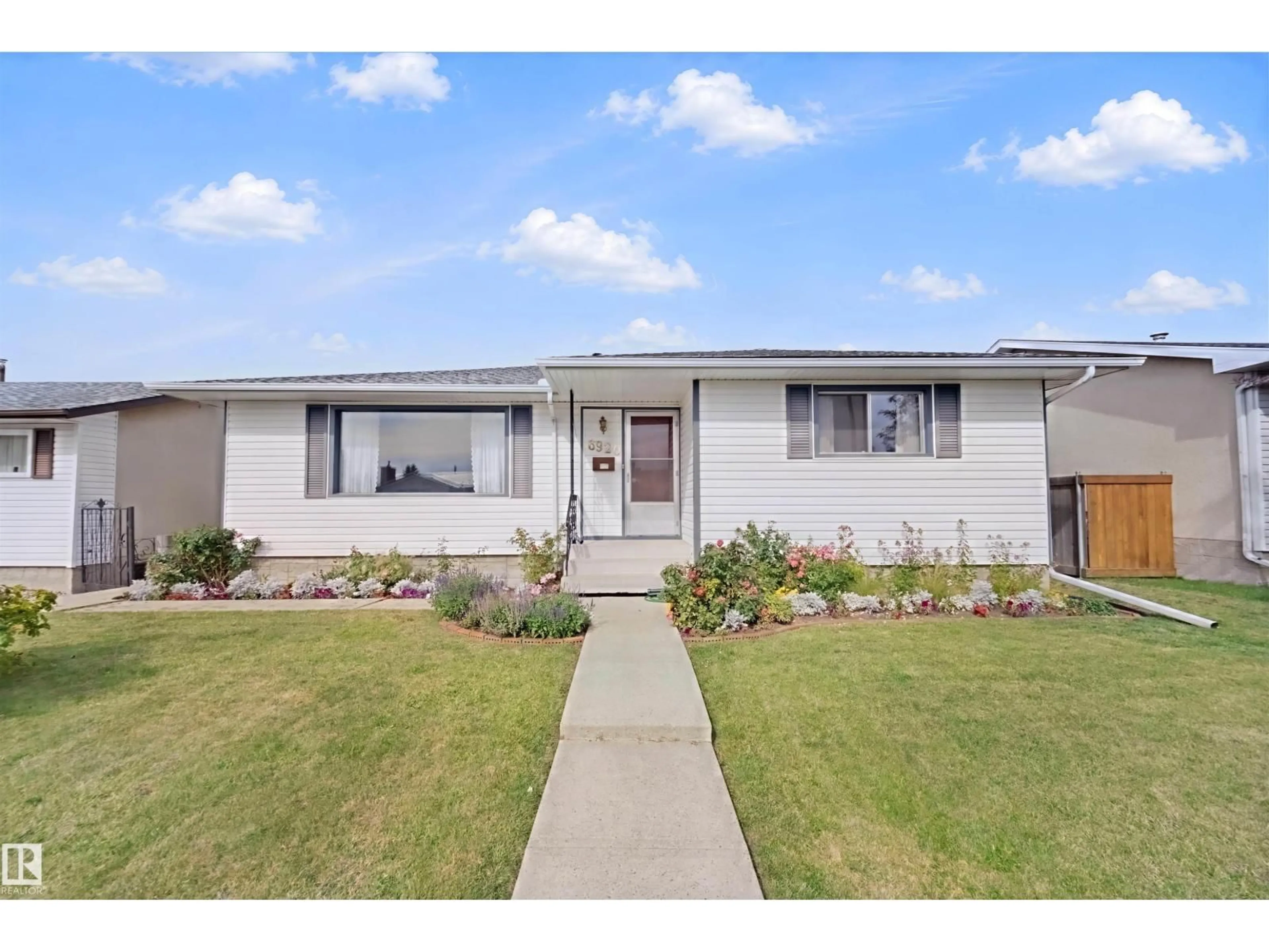 Home with vinyl exterior material, street for 6920 152A AV, Edmonton Alberta T5C2Y9