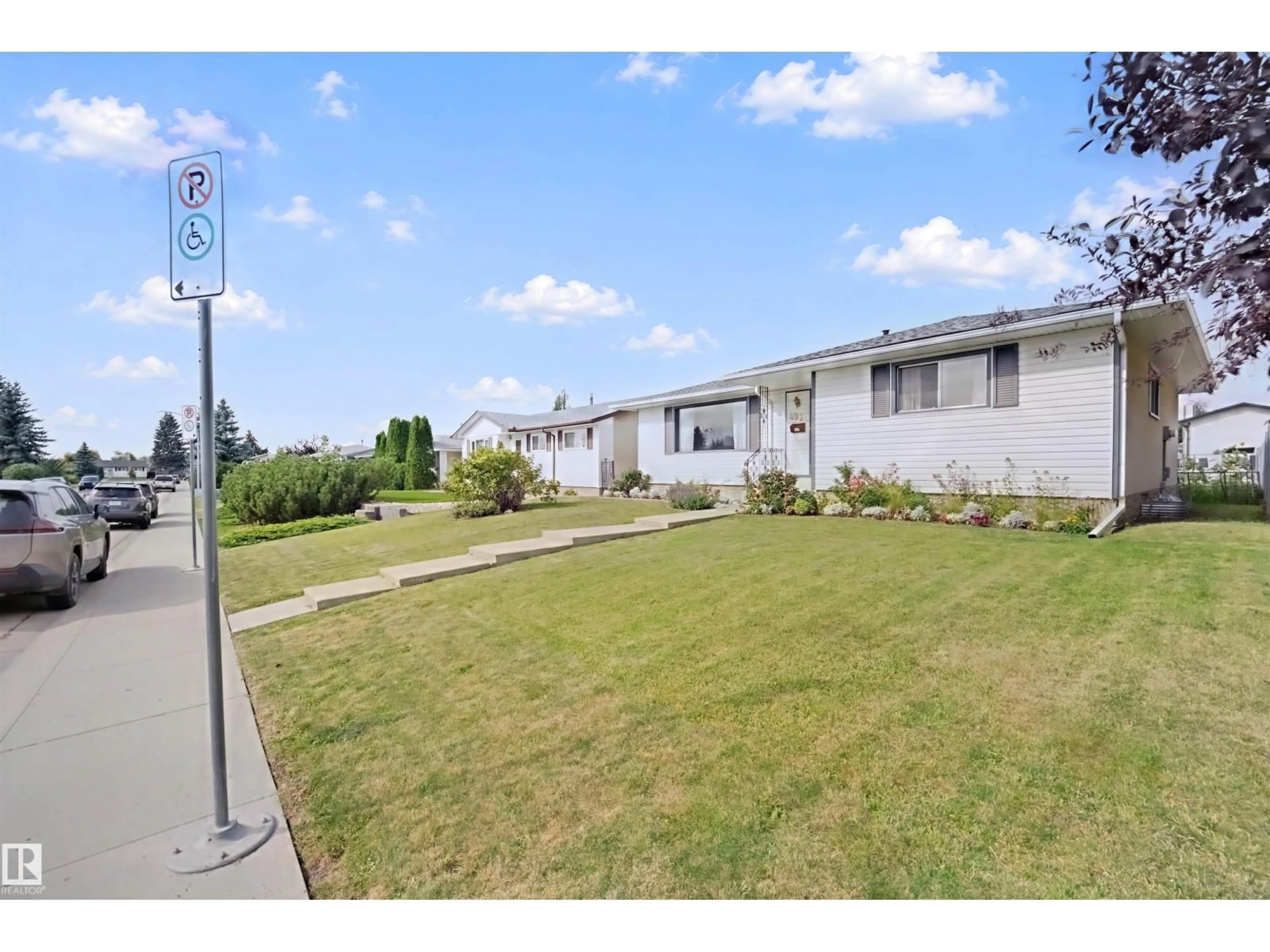 A pic from outside/outdoor area/front of a property/back of a property/a pic from drone, street for 6920 152A AV, Edmonton Alberta T5C2Y9
