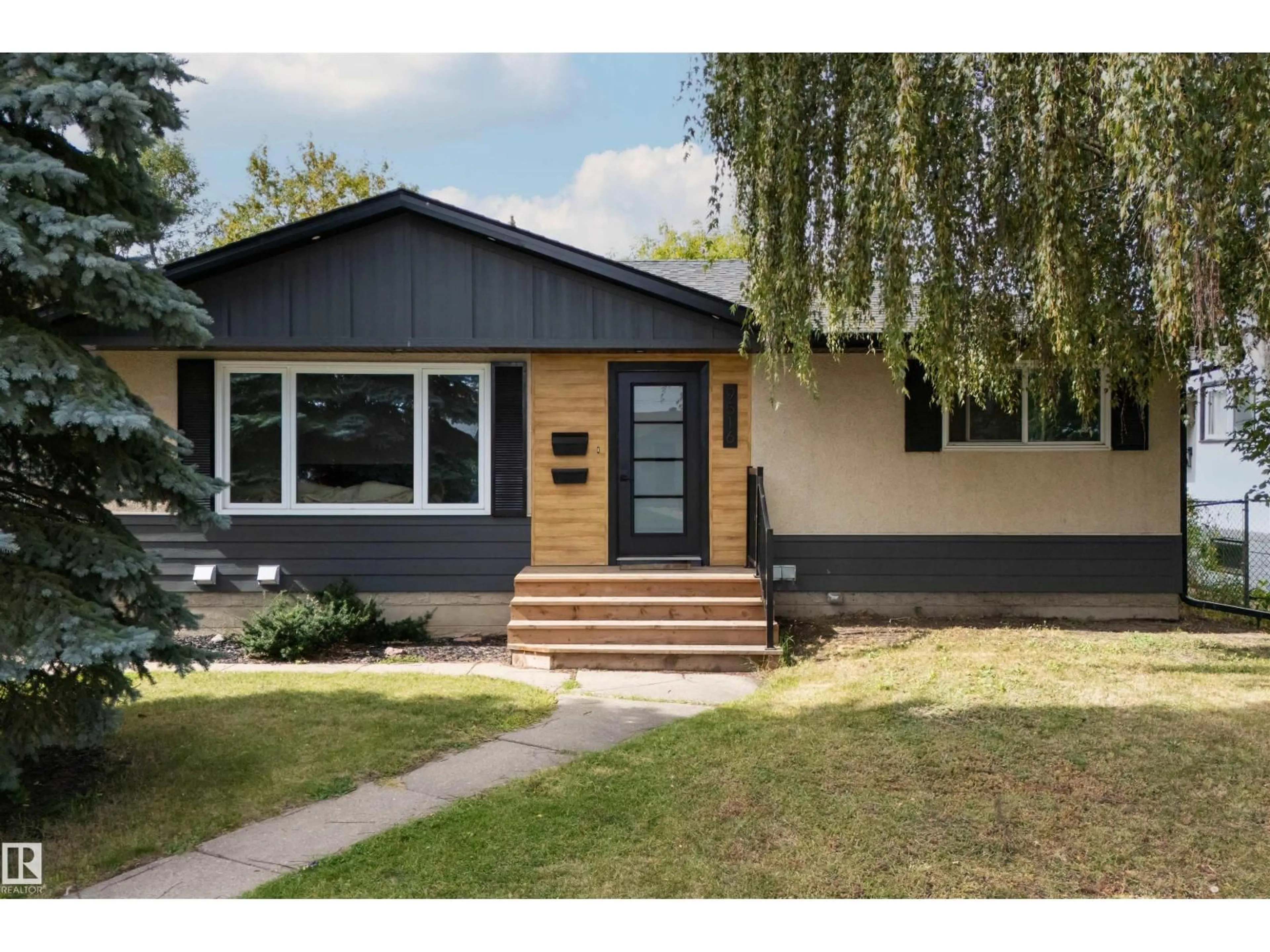 Home with vinyl exterior material, street for NW - 9516 52 ST, Edmonton Alberta T6B1G9