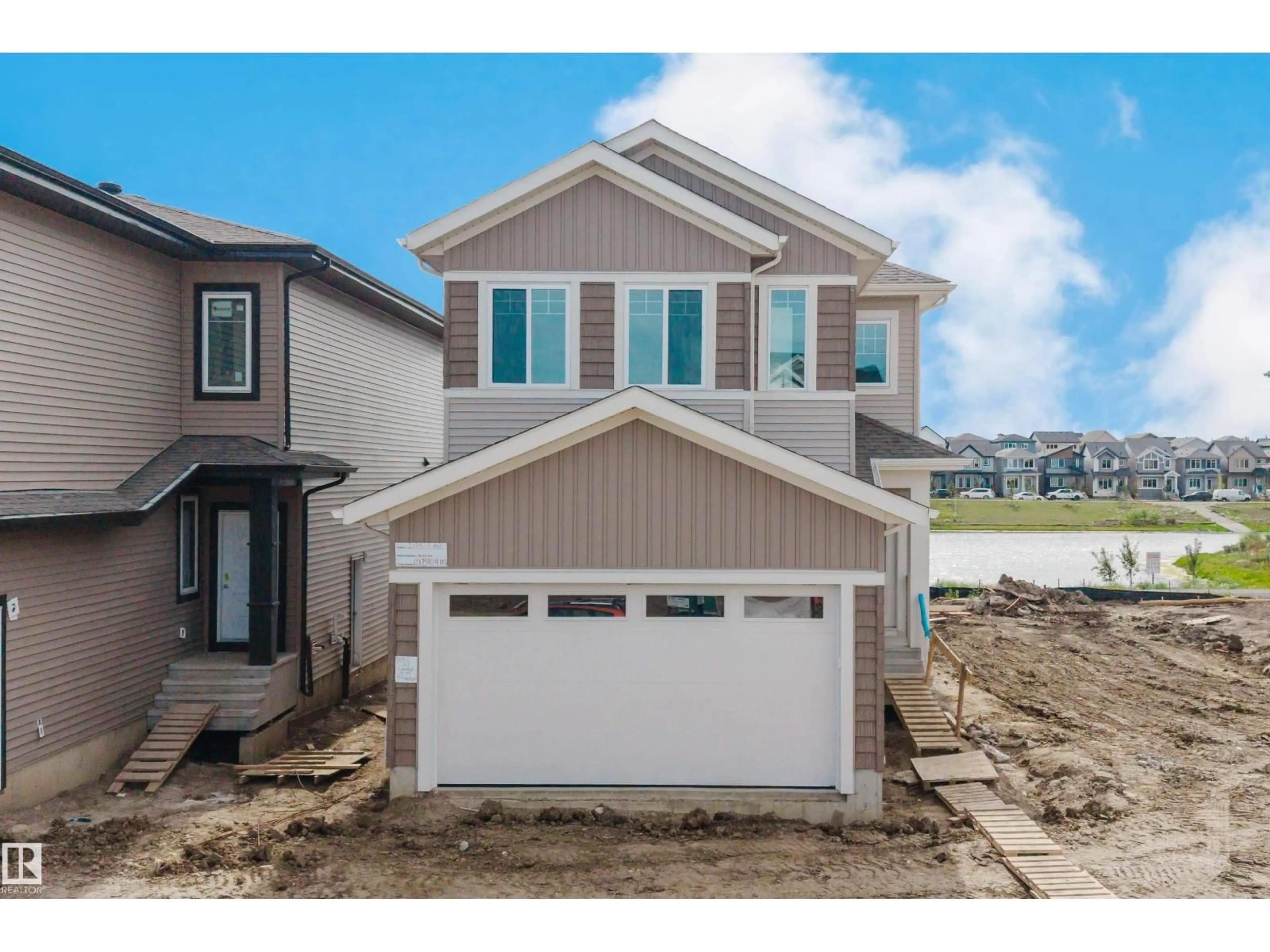 Home with vinyl exterior material, street for SW - 2135 1 AV, Edmonton Alberta T6X3C9