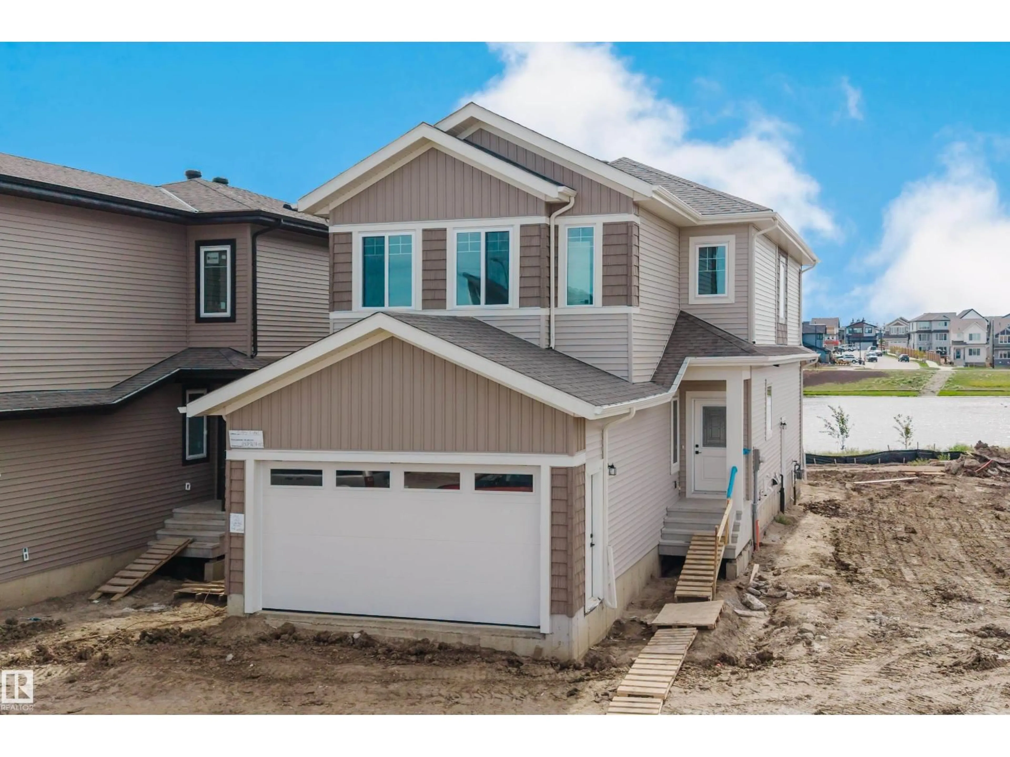 Home with vinyl exterior material, street for SW - 2135 1 AV, Edmonton Alberta T6X3C9