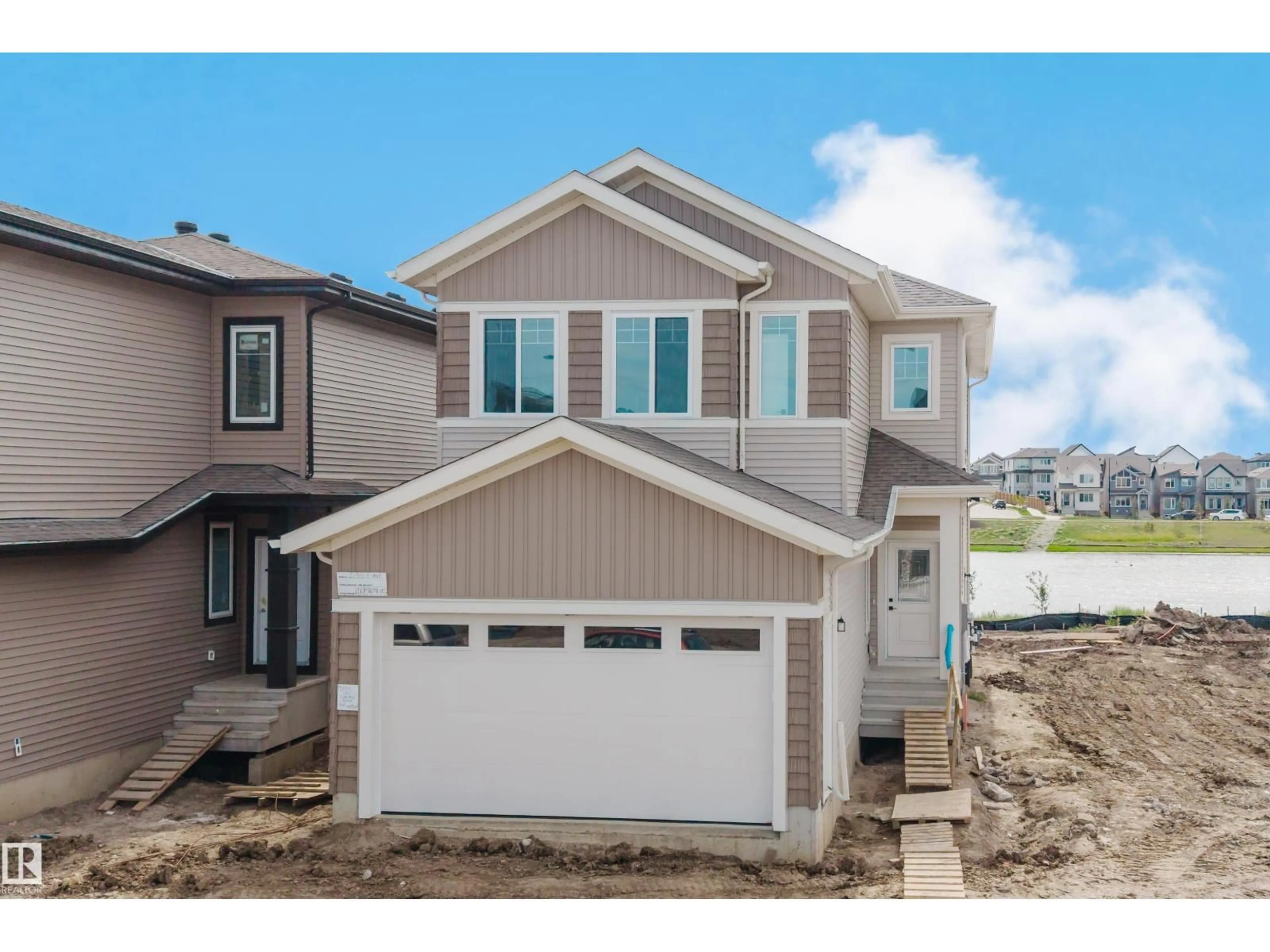 Home with vinyl exterior material, street for SW - 2135 1 AV, Edmonton Alberta T6X3C9