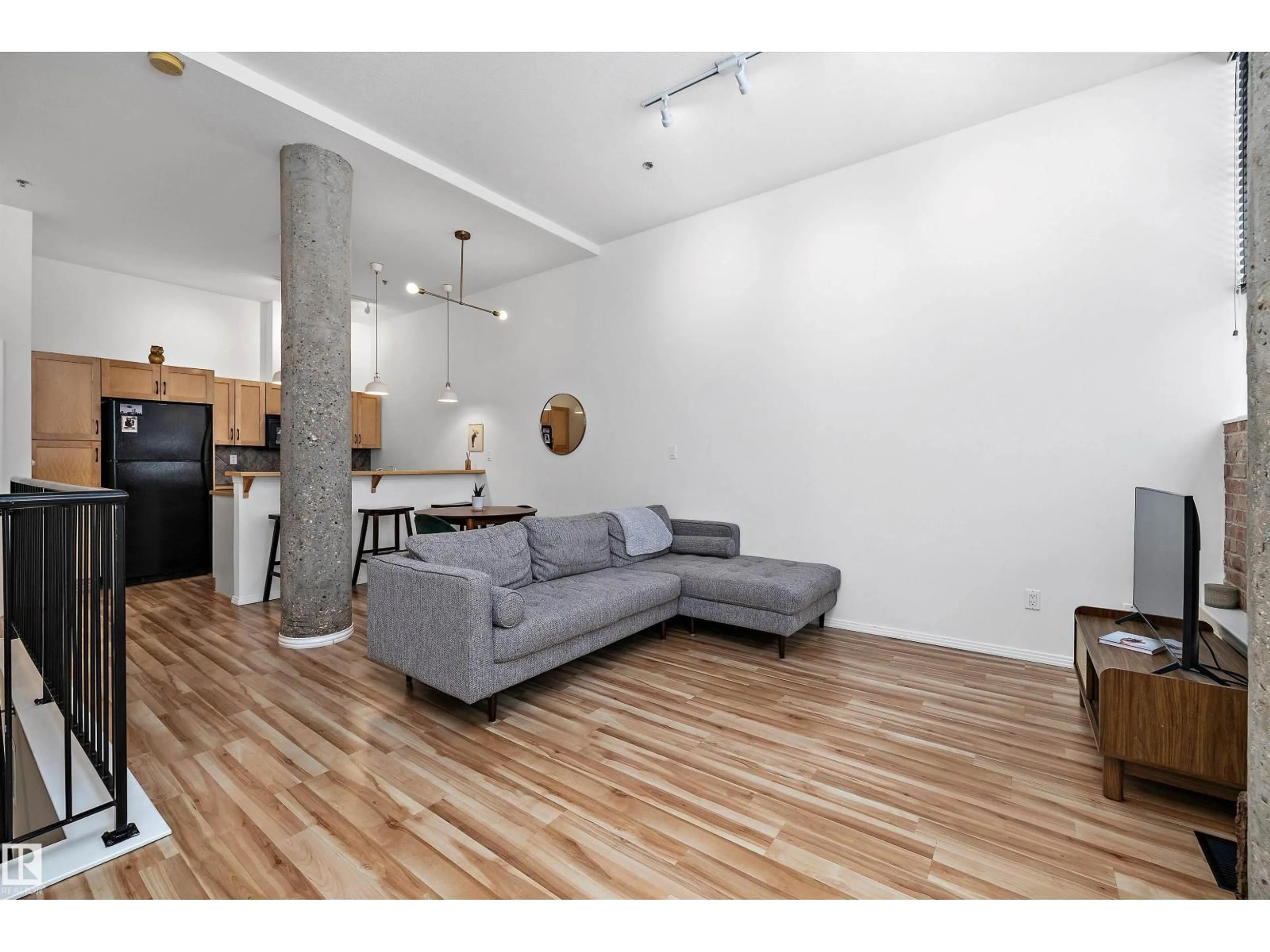 Living room with furniture, wood/laminate floor for #104 - 10123 112 ST, Edmonton Alberta T5K1M1
