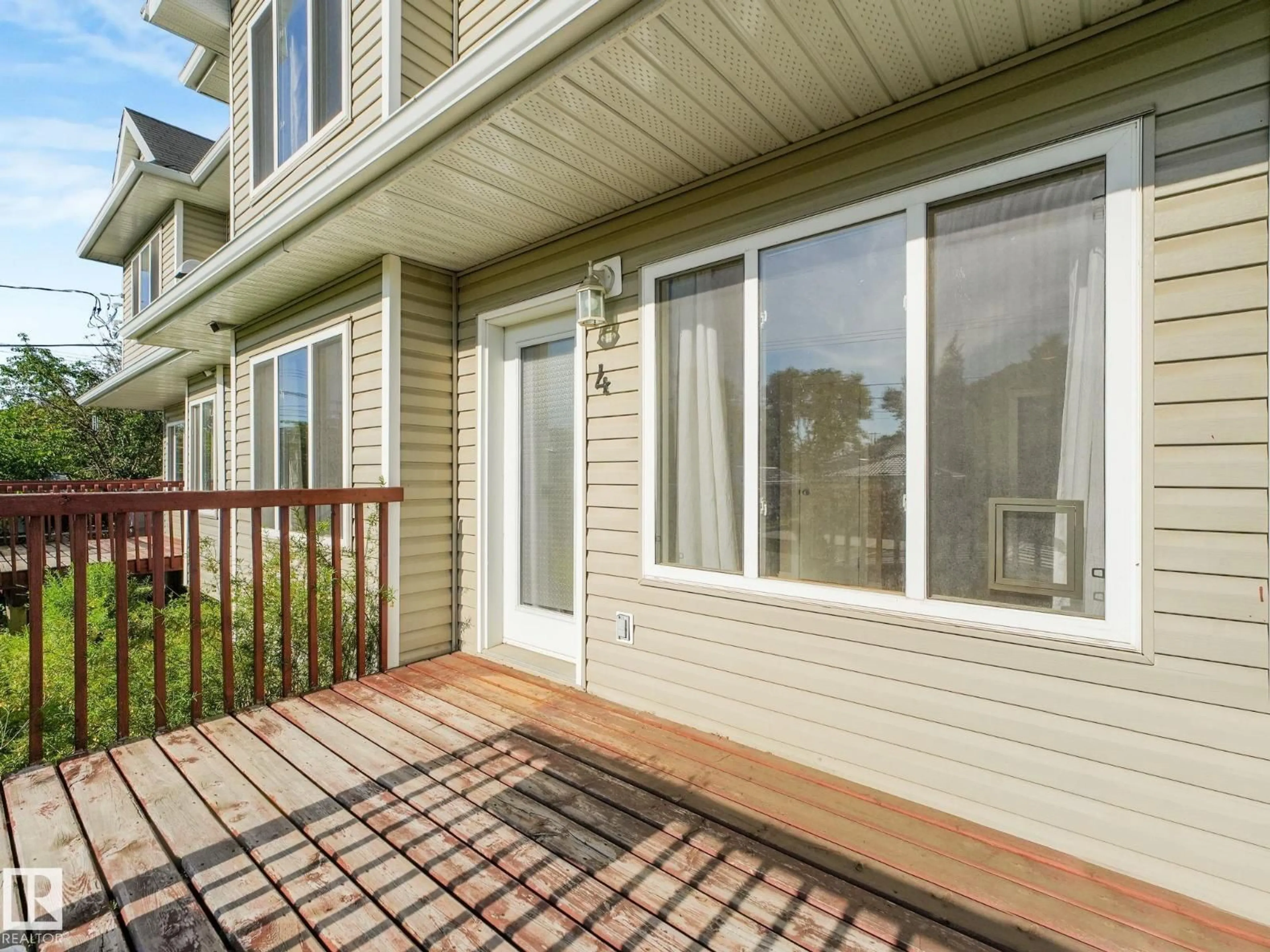 Home with vinyl exterior material, street for #4 - 11813 43 ST, Edmonton Alberta T5W2P3