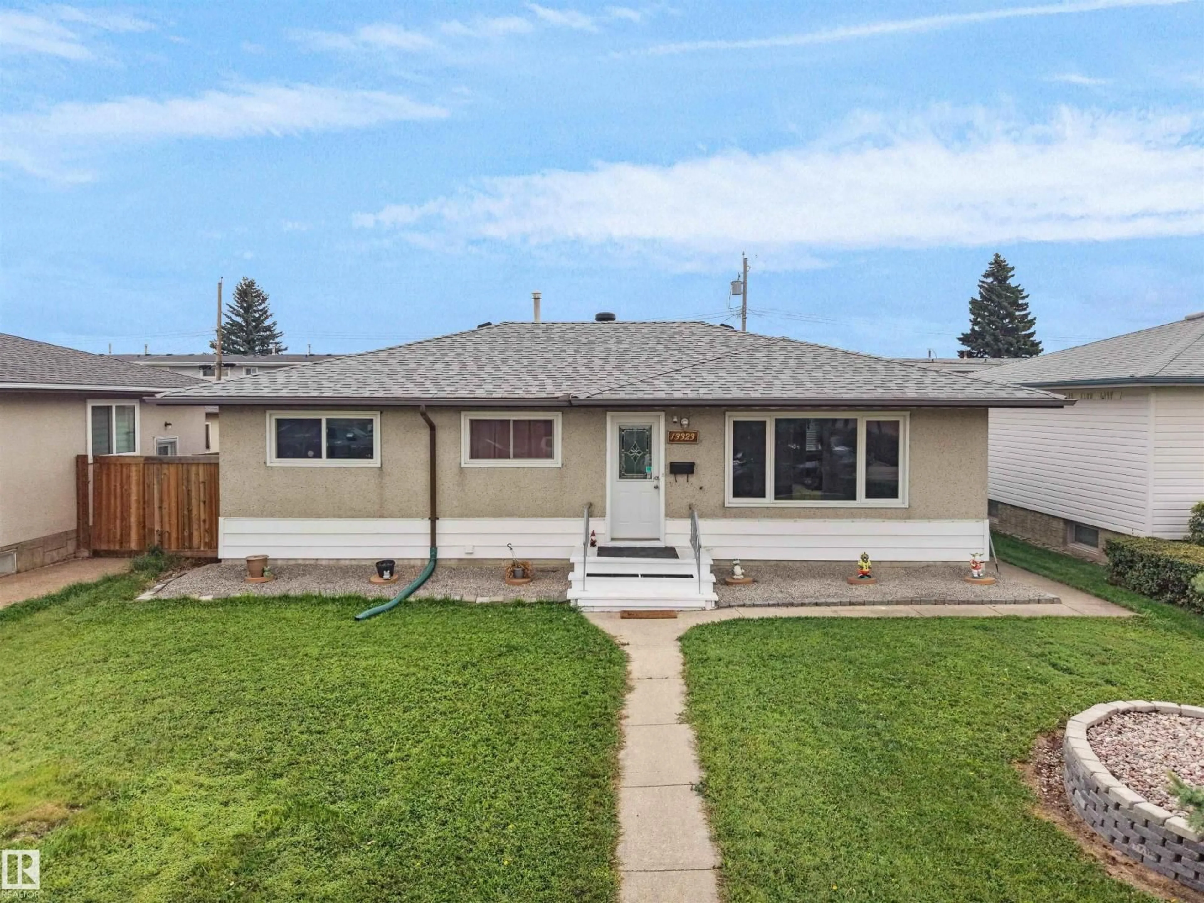 Home with vinyl exterior material, street for 13323 114 STREET NW, Edmonton Alberta T5E5E3