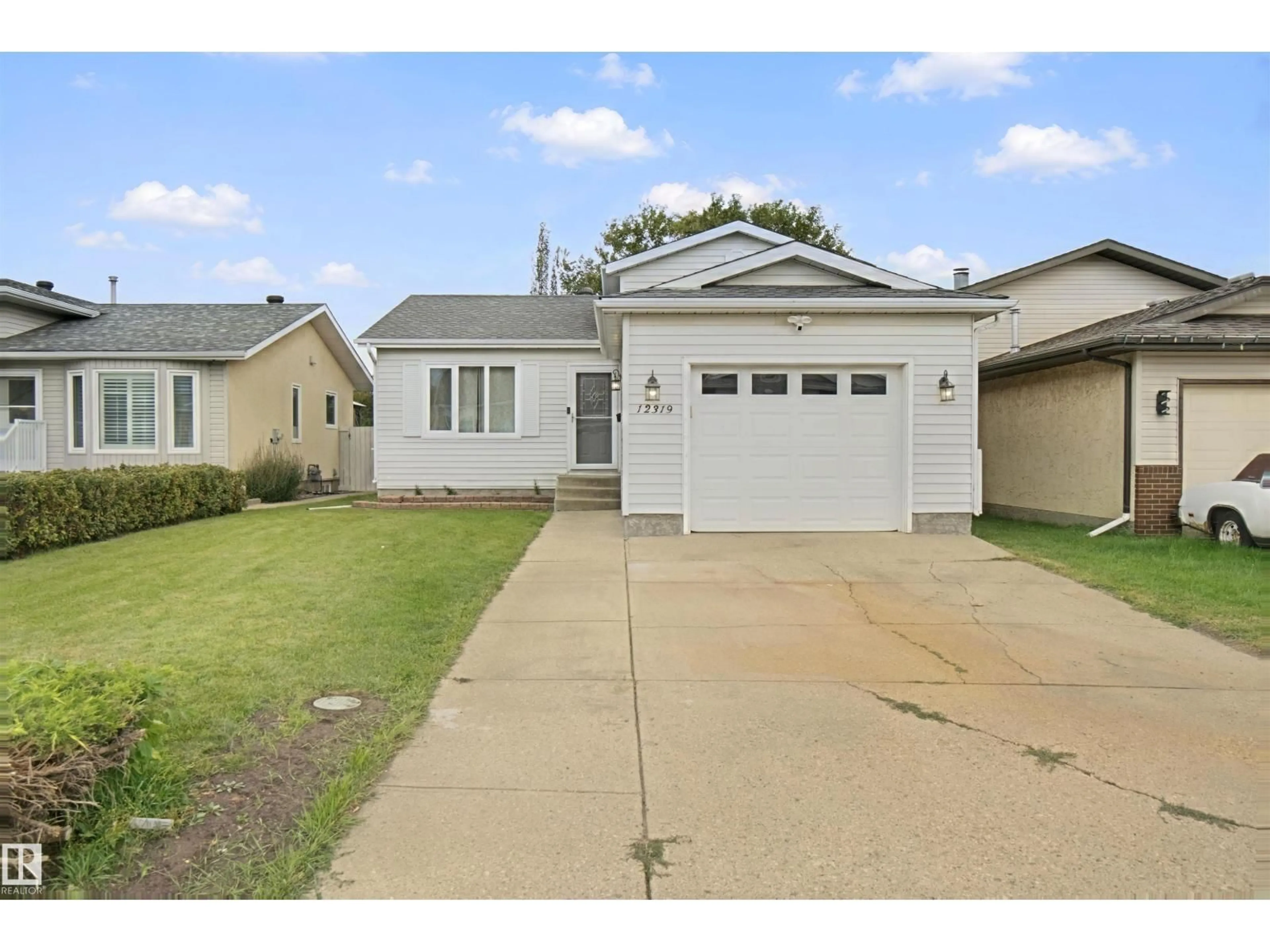 Home with vinyl exterior material, street for NW - 12319 47 ST, Edmonton Alberta T5W5E5
