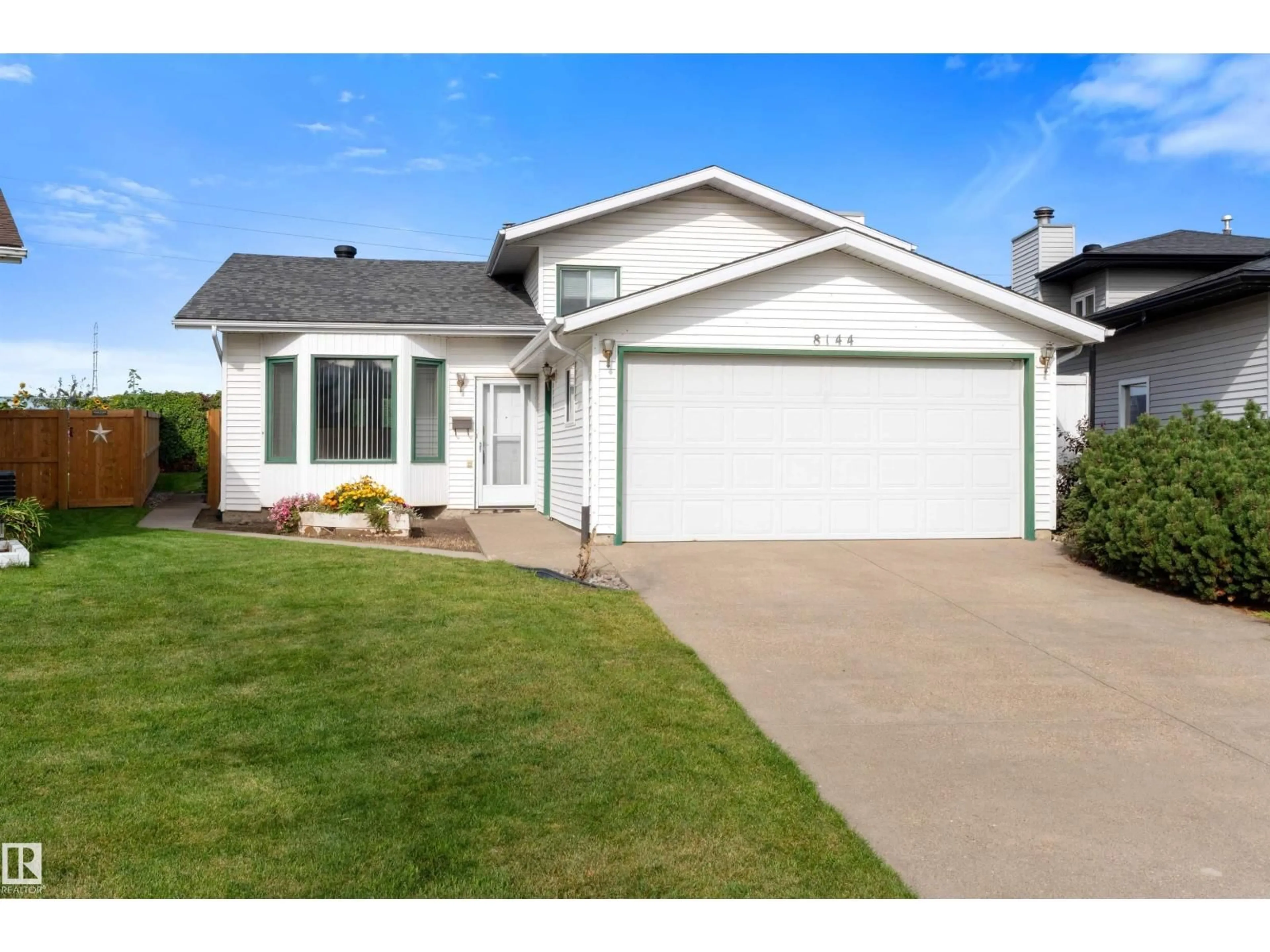Home with vinyl exterior material, street for 8144 190 ST, Edmonton Alberta T5T5C7