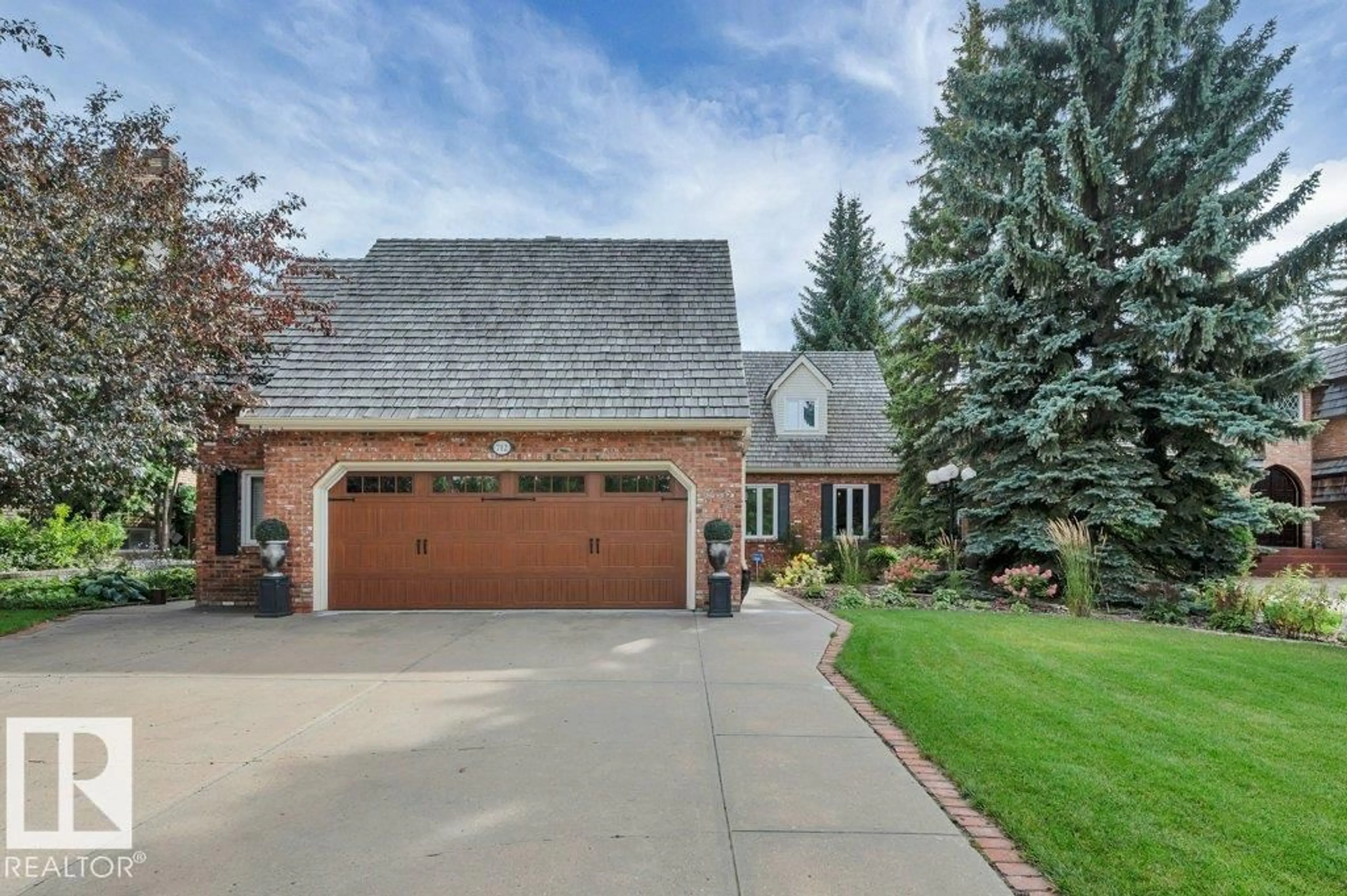 Home with brick exterior material, street for 712 ROMANIUK RD, Edmonton Alberta T6R1A5