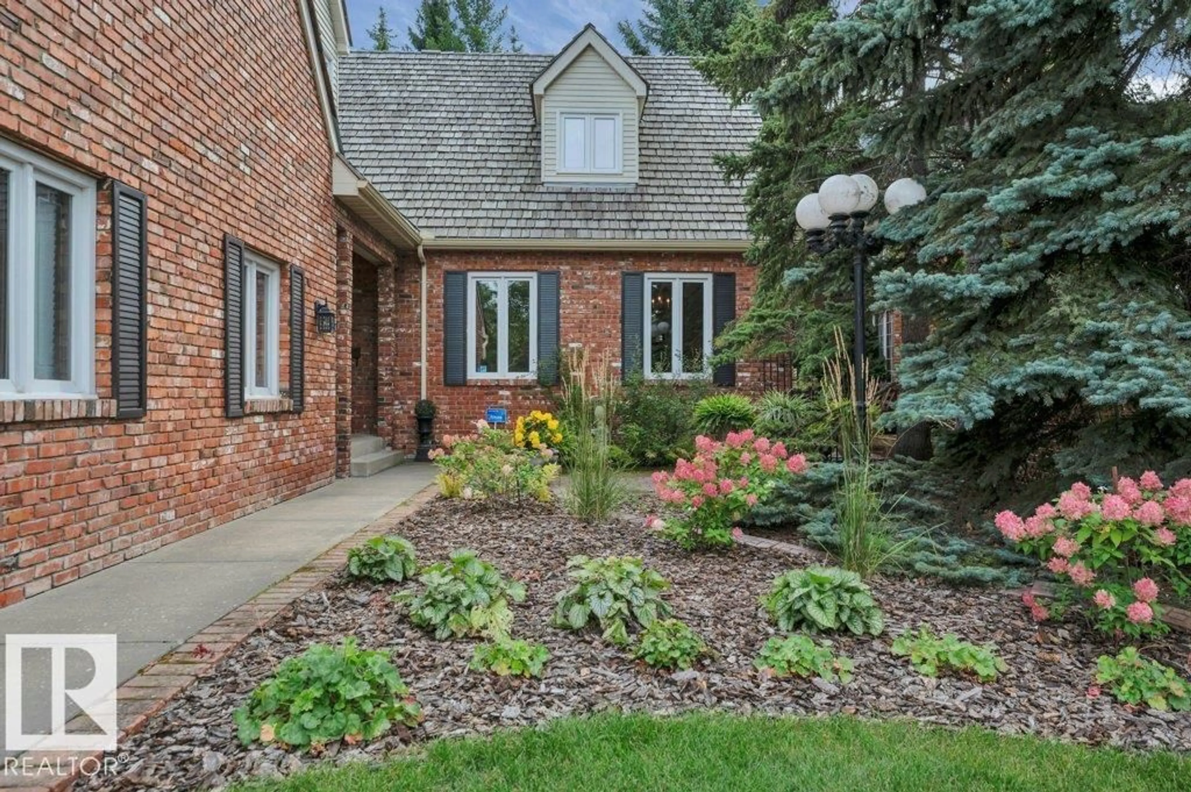 Home with brick exterior material, street for 712 ROMANIUK RD, Edmonton Alberta T6R1A5