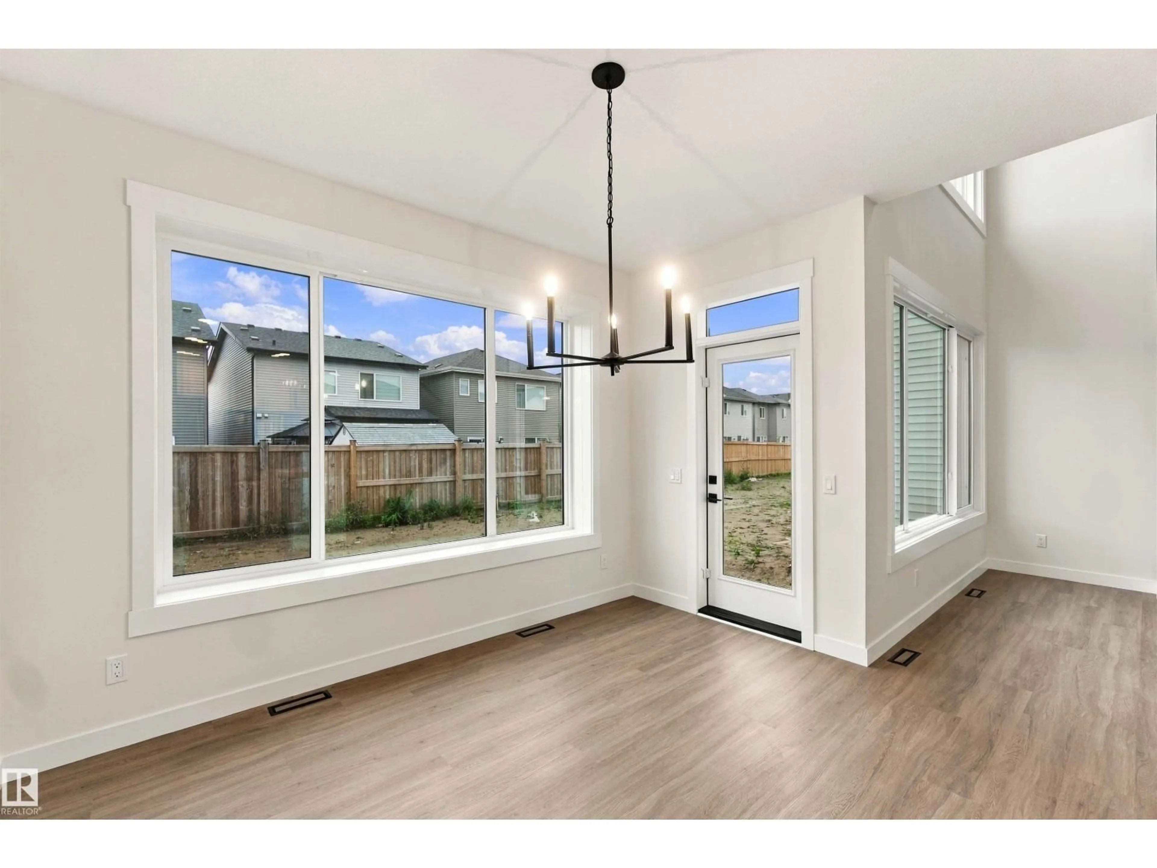 Open concept kitchen, wood/laminate floor for 5852 RAVEN CR, Edmonton Alberta T5S0X8