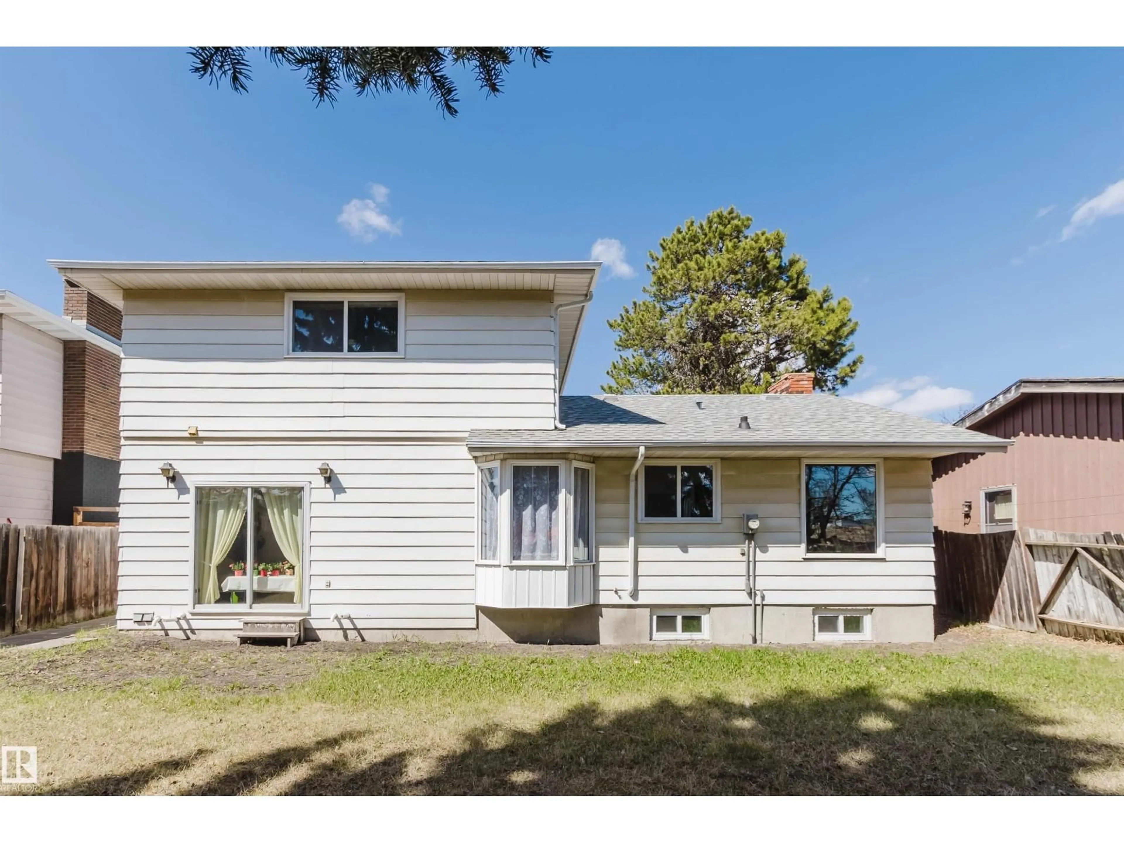 Home with vinyl exterior material, street for NW - 10423 35 AV, Edmonton Alberta T6J2M8