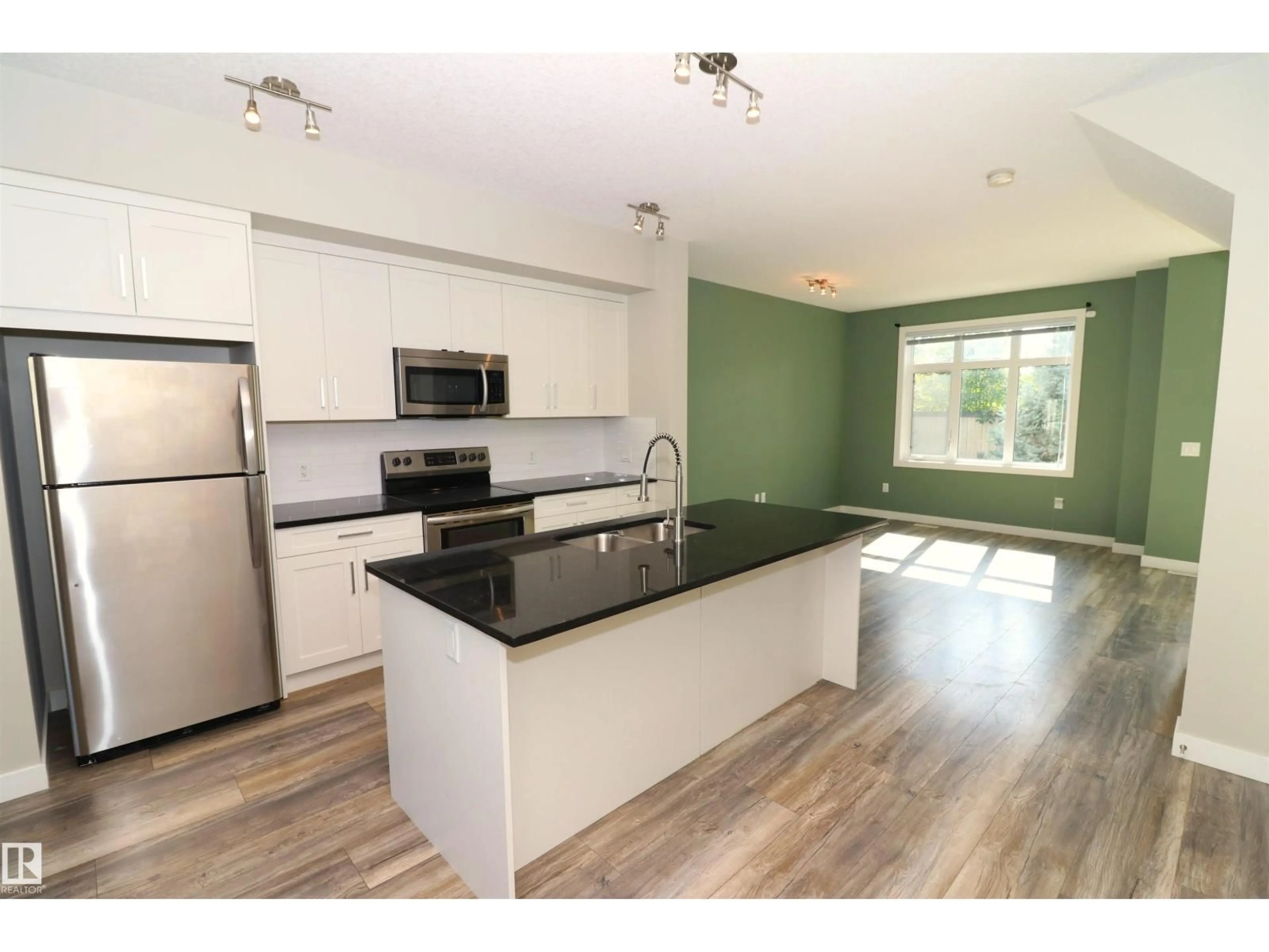 Open concept kitchen, wood/laminate floor for 77 BELLEROSE DR, St. Albert Alberta T8N7T5