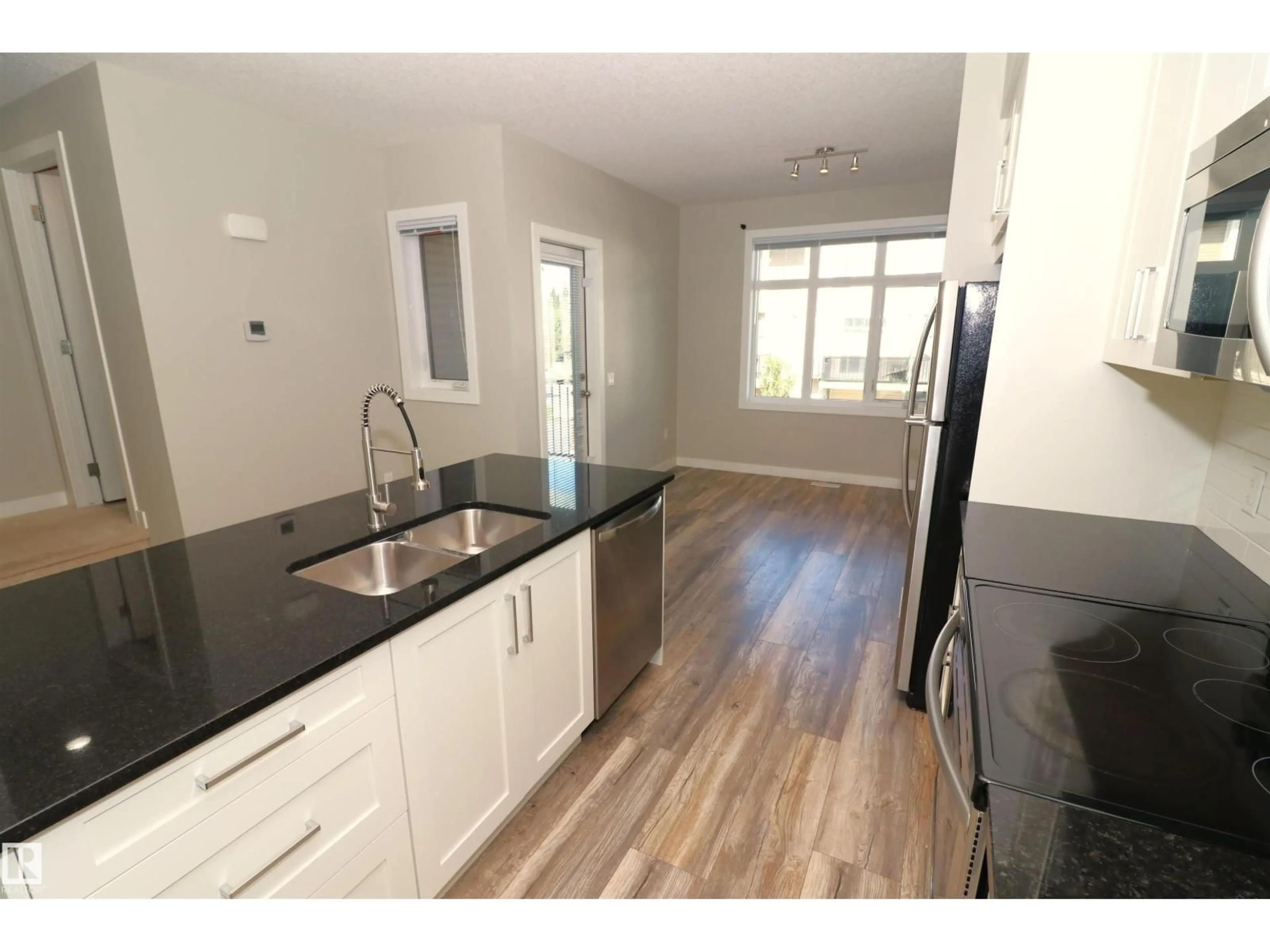 Open concept kitchen, wood/laminate floor for 77 BELLEROSE DR, St. Albert Alberta T8N7T5
