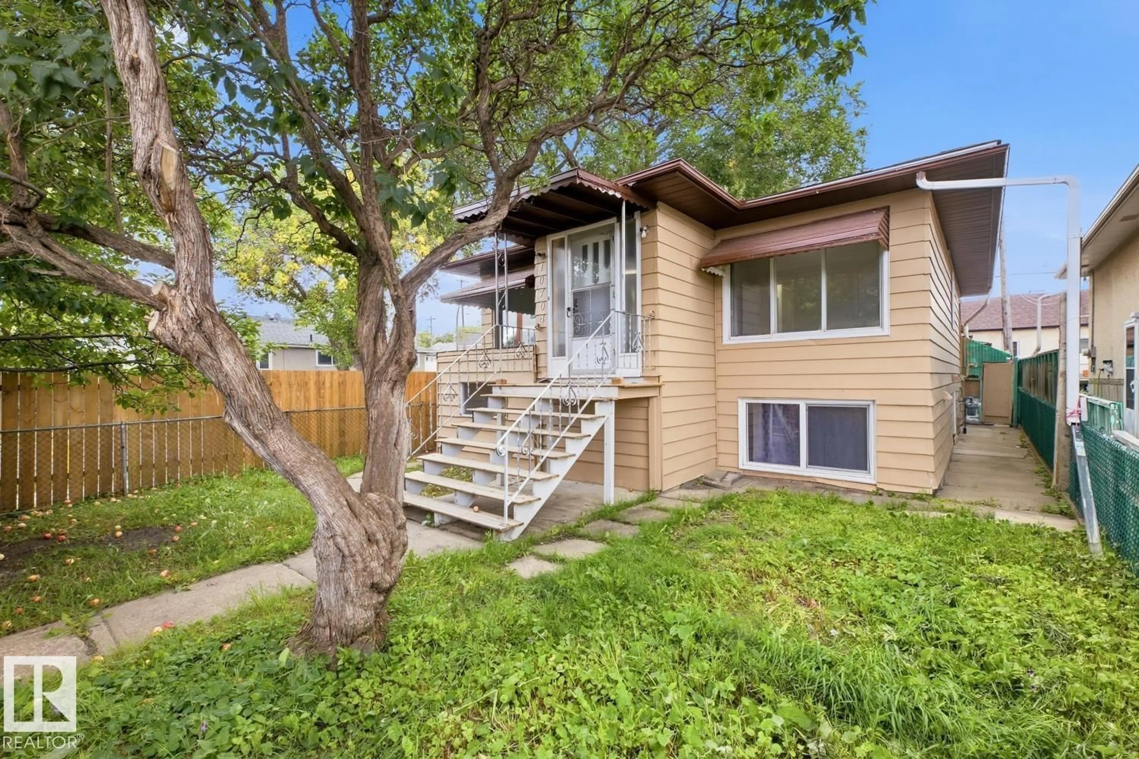 Home with vinyl exterior material, street for 10704 96 ST, Edmonton Alberta T5H2J6