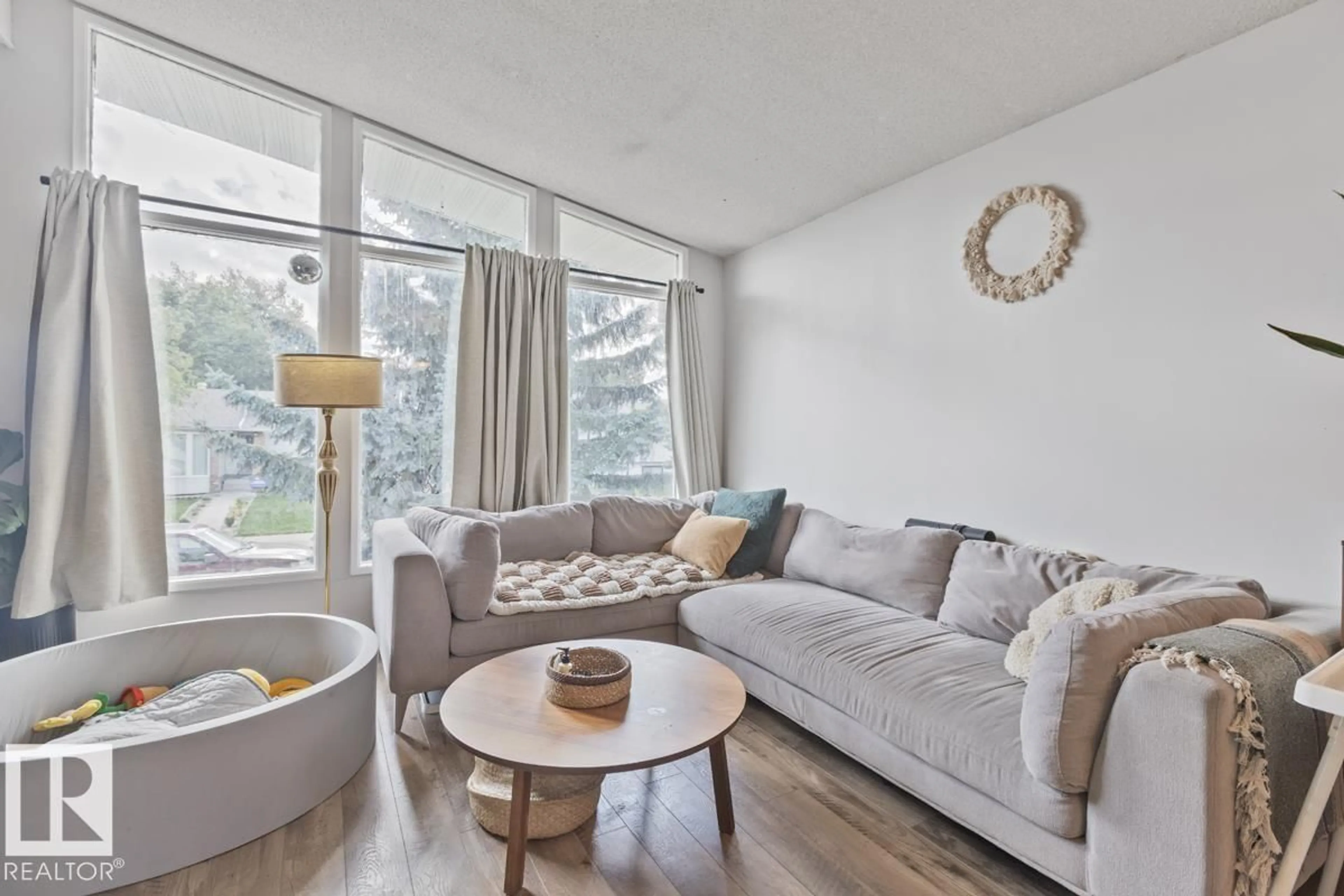 Living room with furniture, unknown for 8808 43 AV, Edmonton Alberta T6K1A7