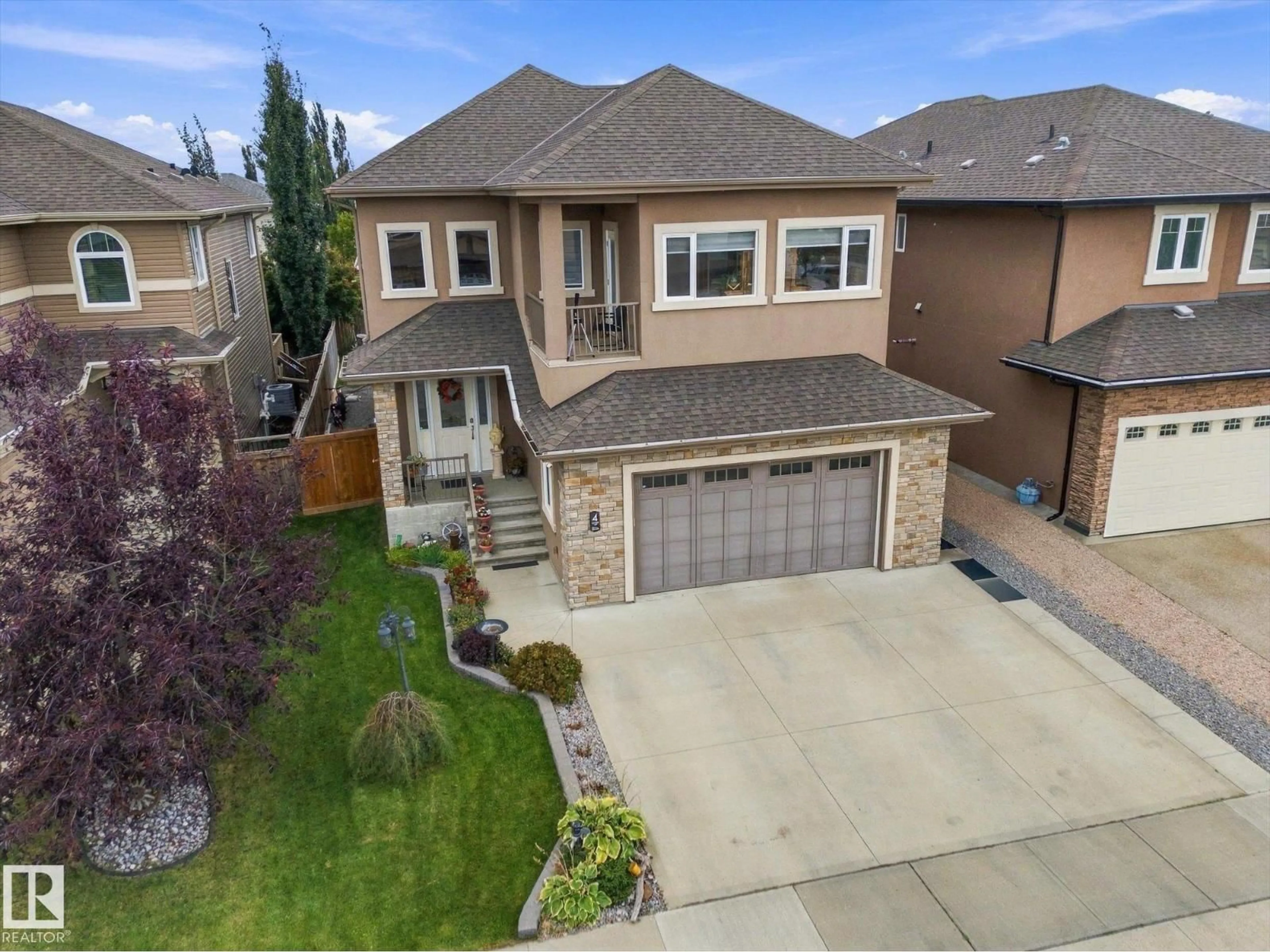 A pic from outside/outdoor area/front of a property/back of a property/a pic from drone, street for 4 LAKESHORE CV, Beaumont Alberta T4X0J2