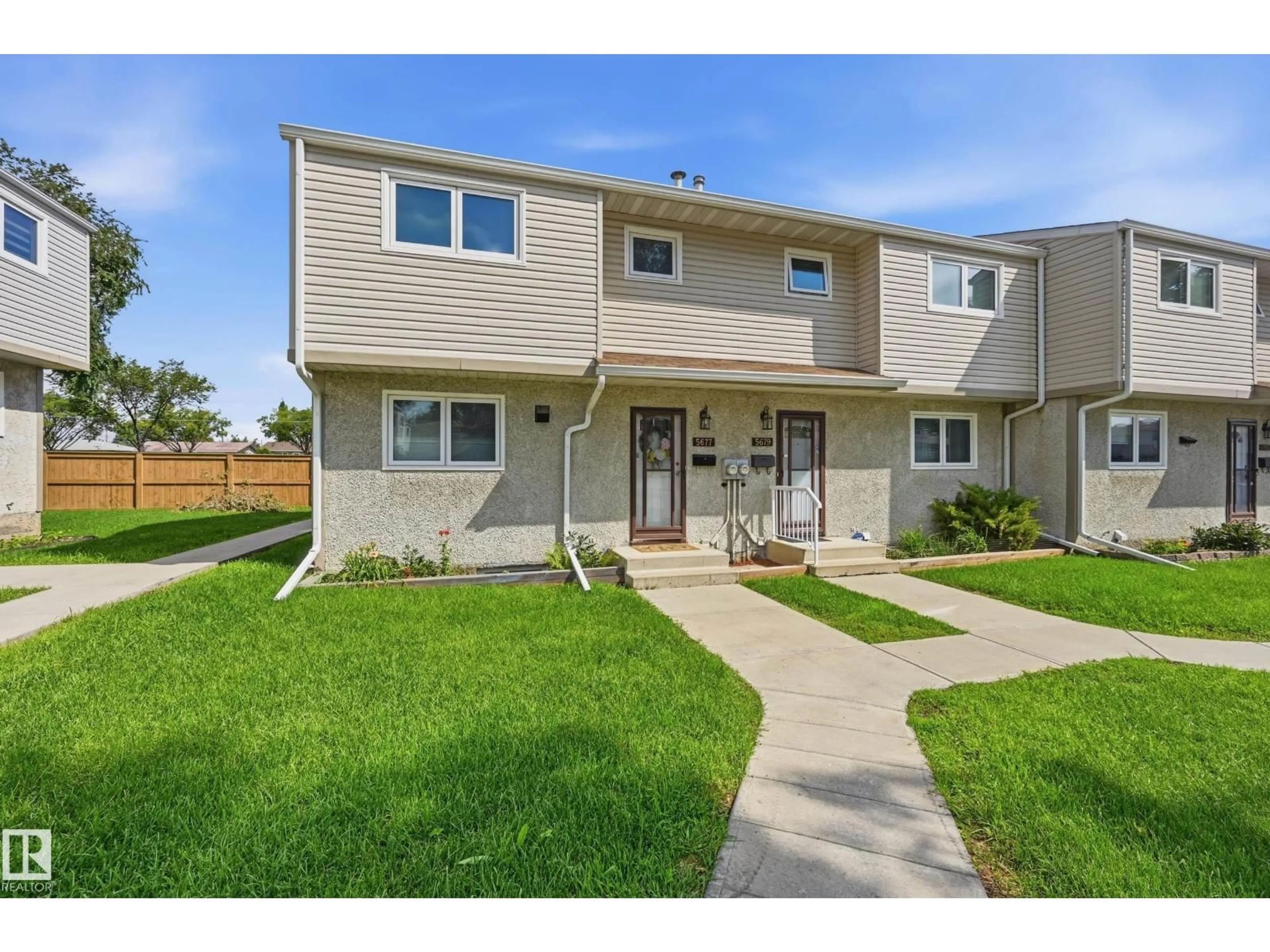 Home with vinyl exterior material, street for 5677 137 AV, Edmonton Alberta T5A2H4