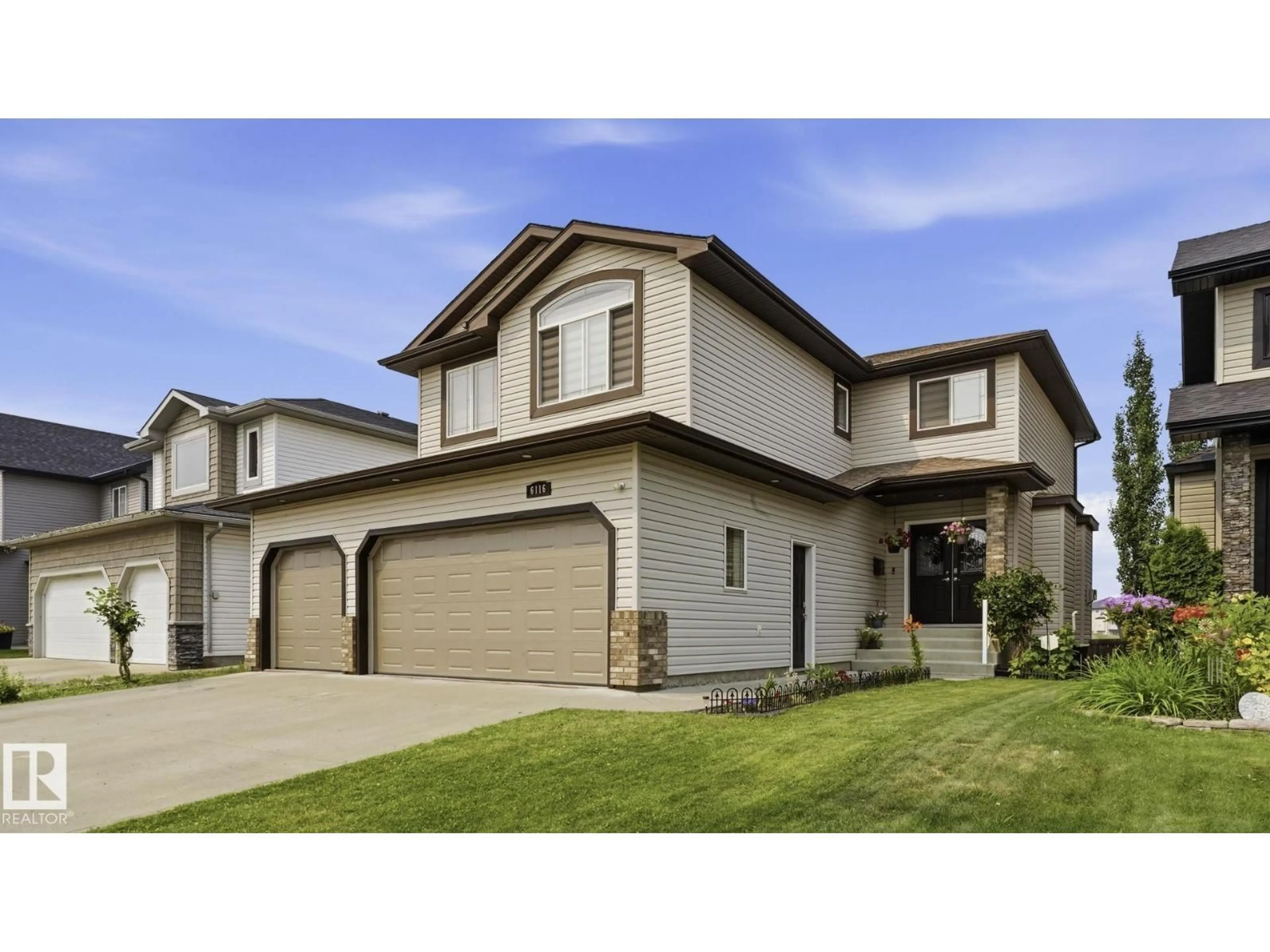 Home with vinyl exterior material, street for 6116 53 AV, Beaumont Alberta T4X1V6