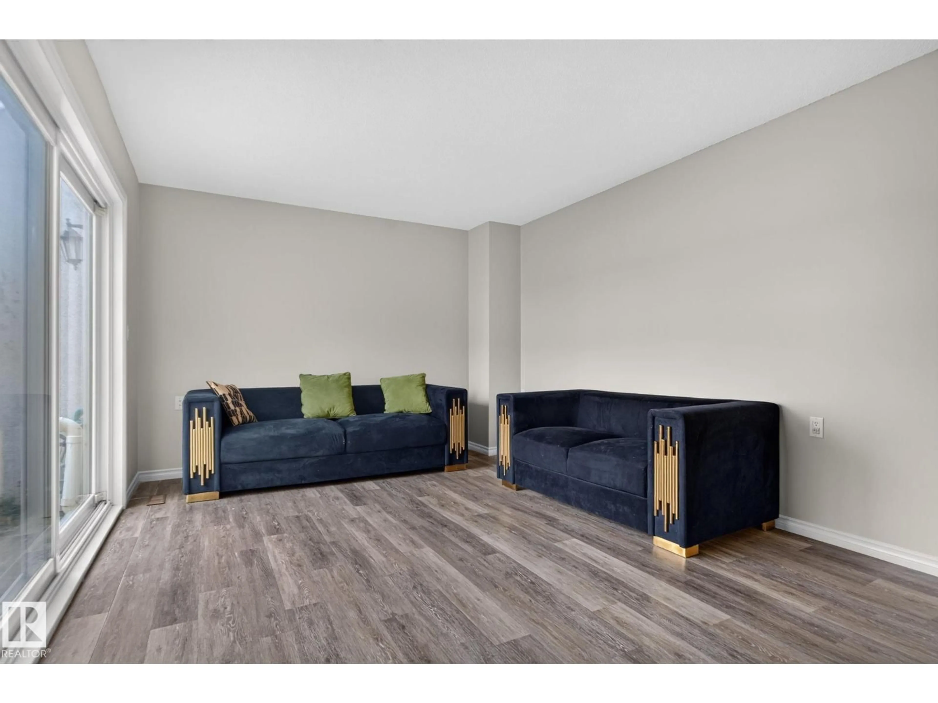 Living room with furniture, wood/laminate floor for NW - 17775 95 ST, Edmonton Alberta T5Z2E3