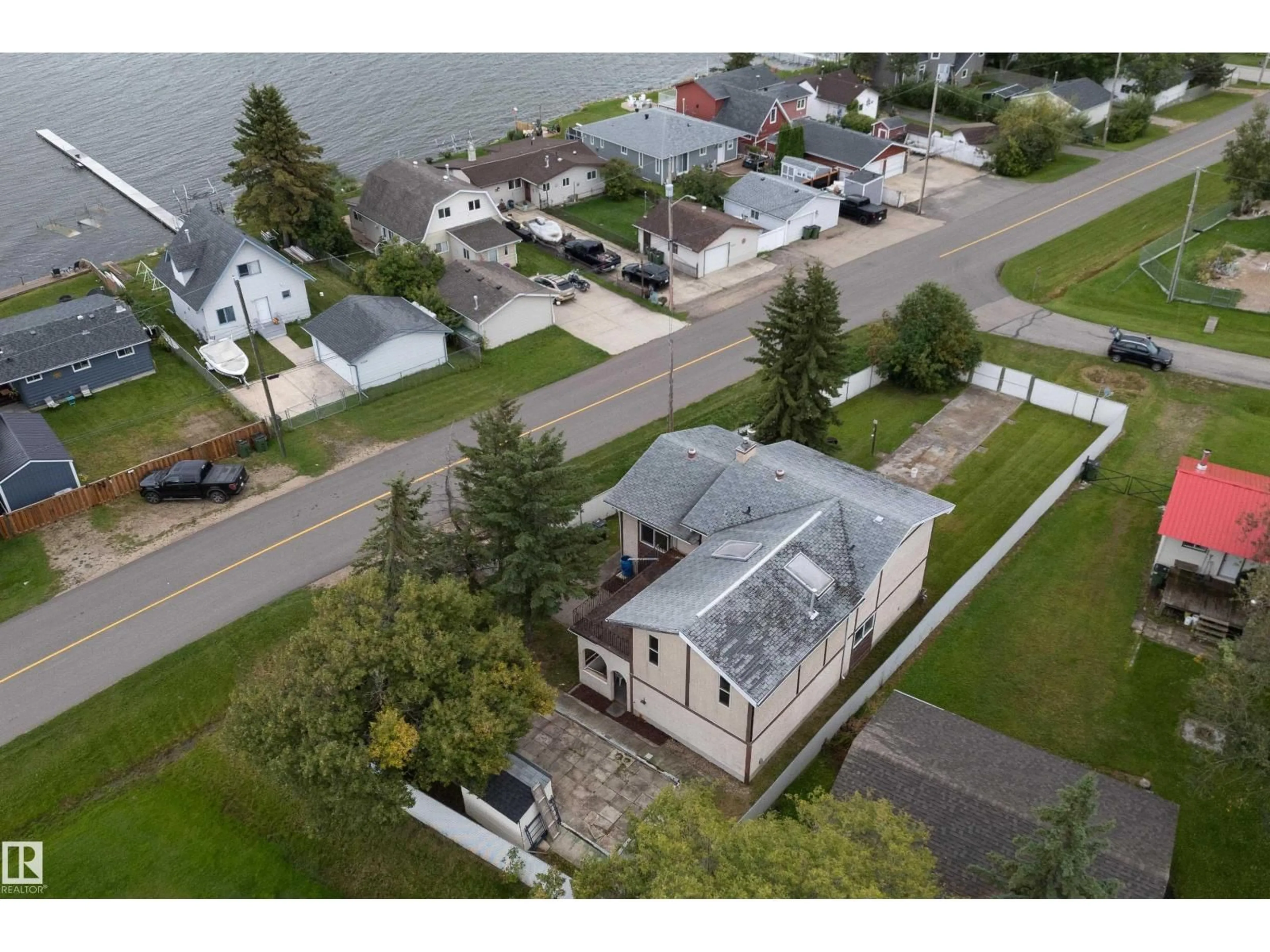 A pic from outside/outdoor area/front of a property/back of a property/a pic from drone, water/lake/river/ocean view for 5039 64 ST, Rural Lac Ste. Anne County Alberta T0E0A0