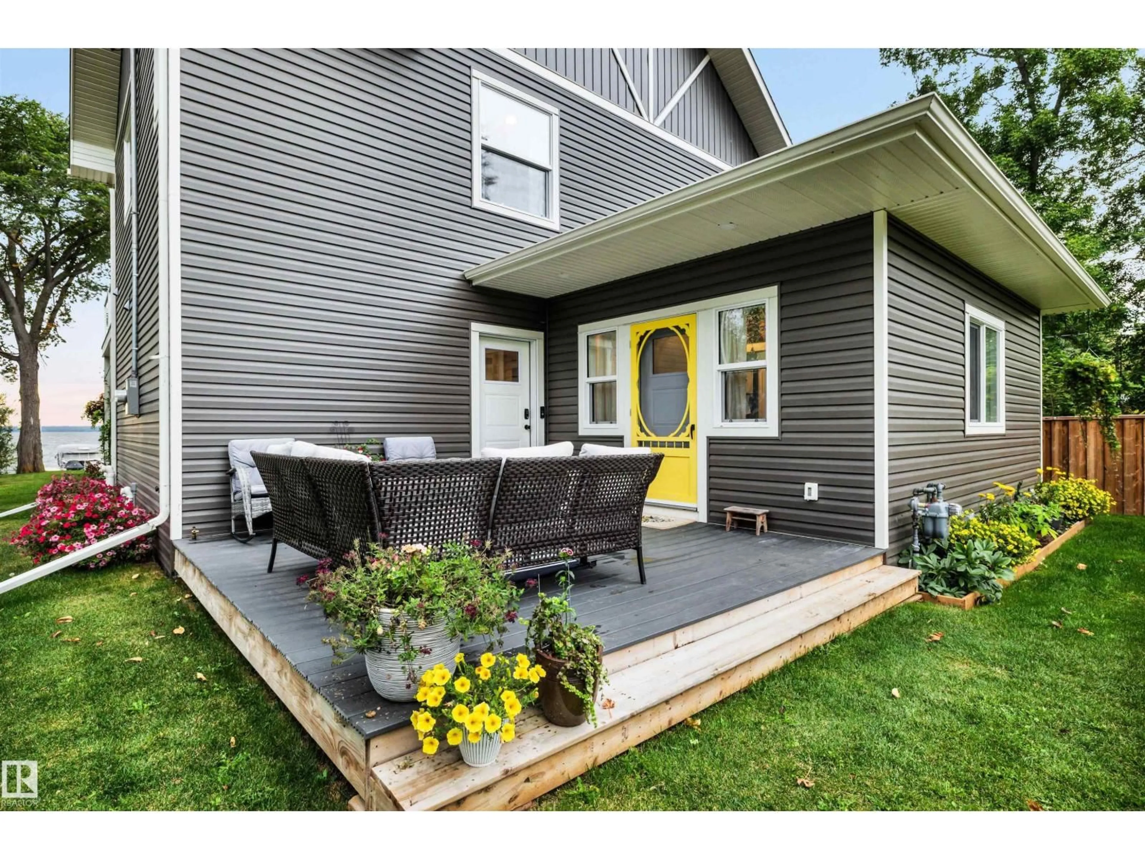 Home with vinyl exterior material, street for 66 BEACH AV, Rural Leduc County Alberta T0C2P0