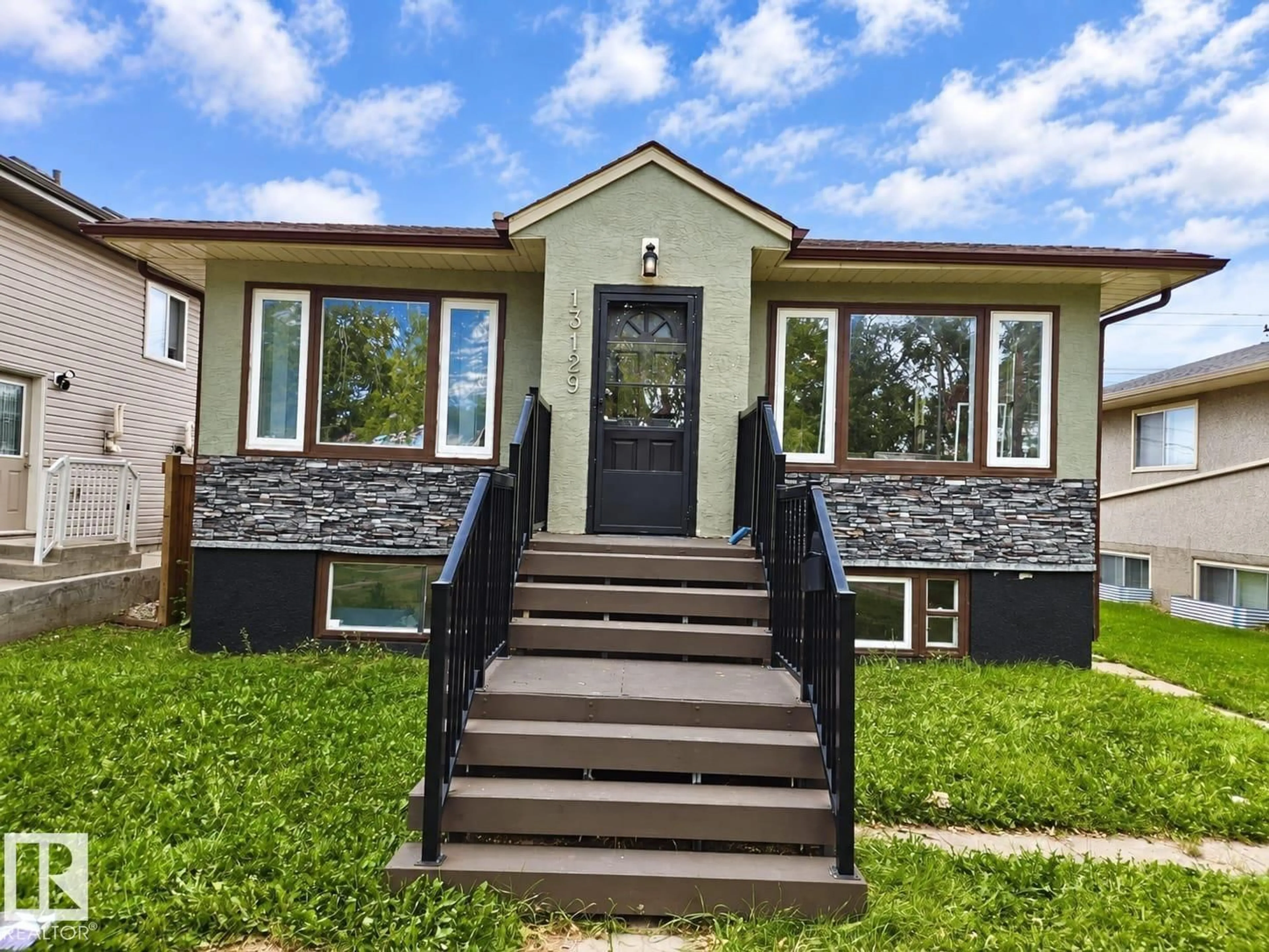 Home with vinyl exterior material, street for 13129 101 ST, Edmonton Alberta T5E4G1