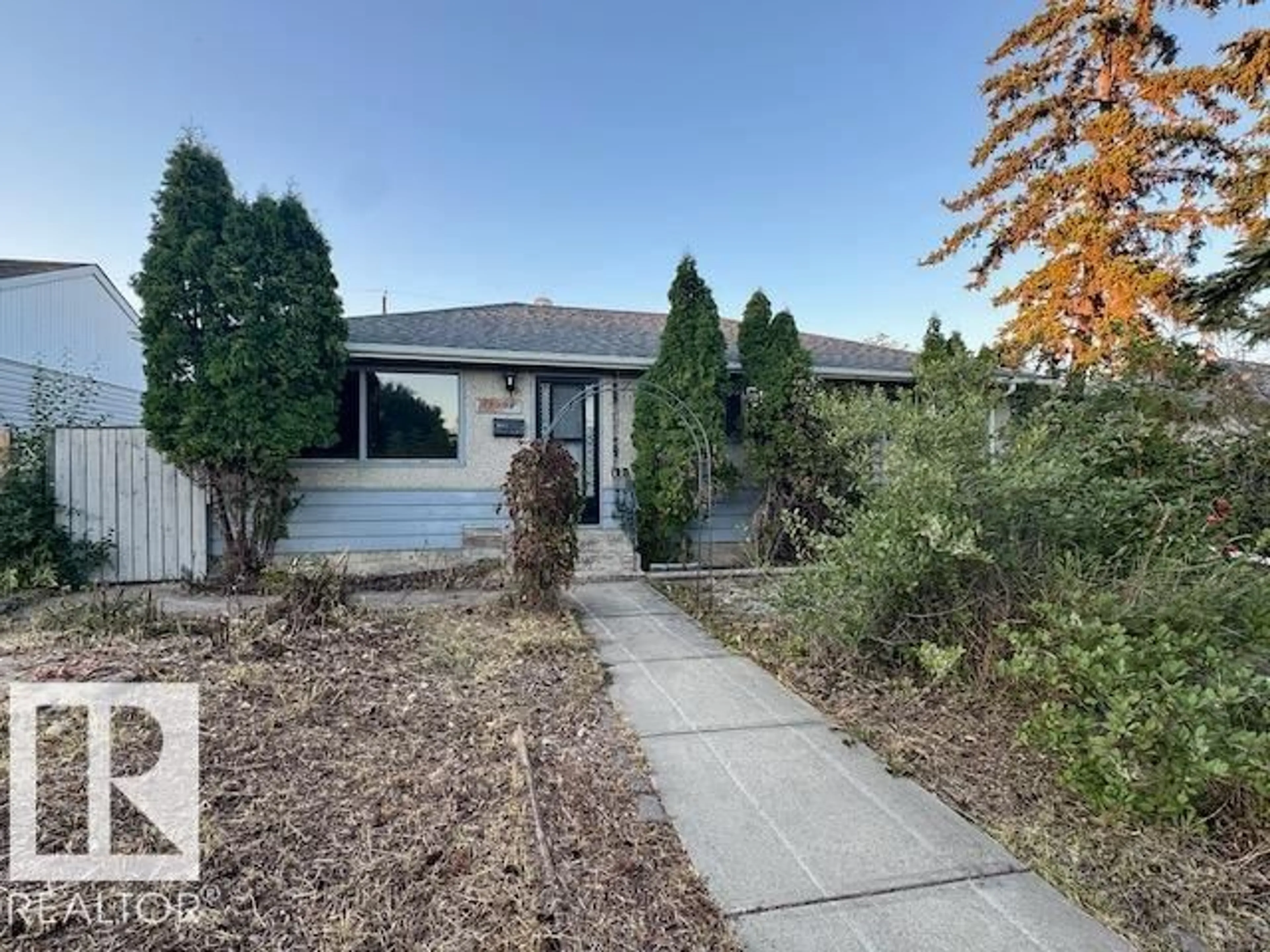 Home with vinyl exterior material, street for NW - 13908 135 AV, Edmonton Alberta T5L3Y8
