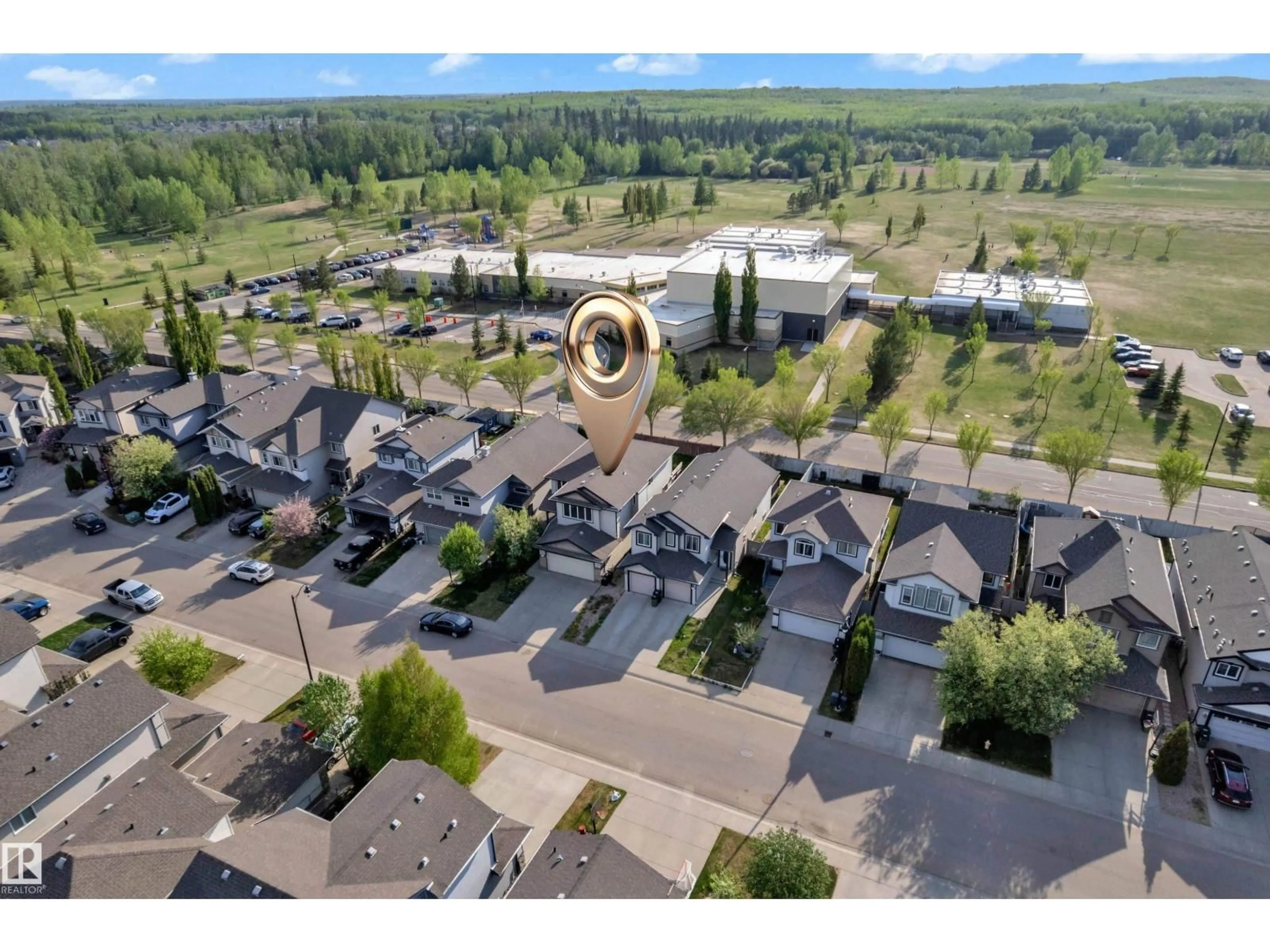 A pic from outside/outdoor area/front of a property/back of a property/a pic from drone, mountain view for 5528 209 ST NW, Edmonton Alberta T6M0E9