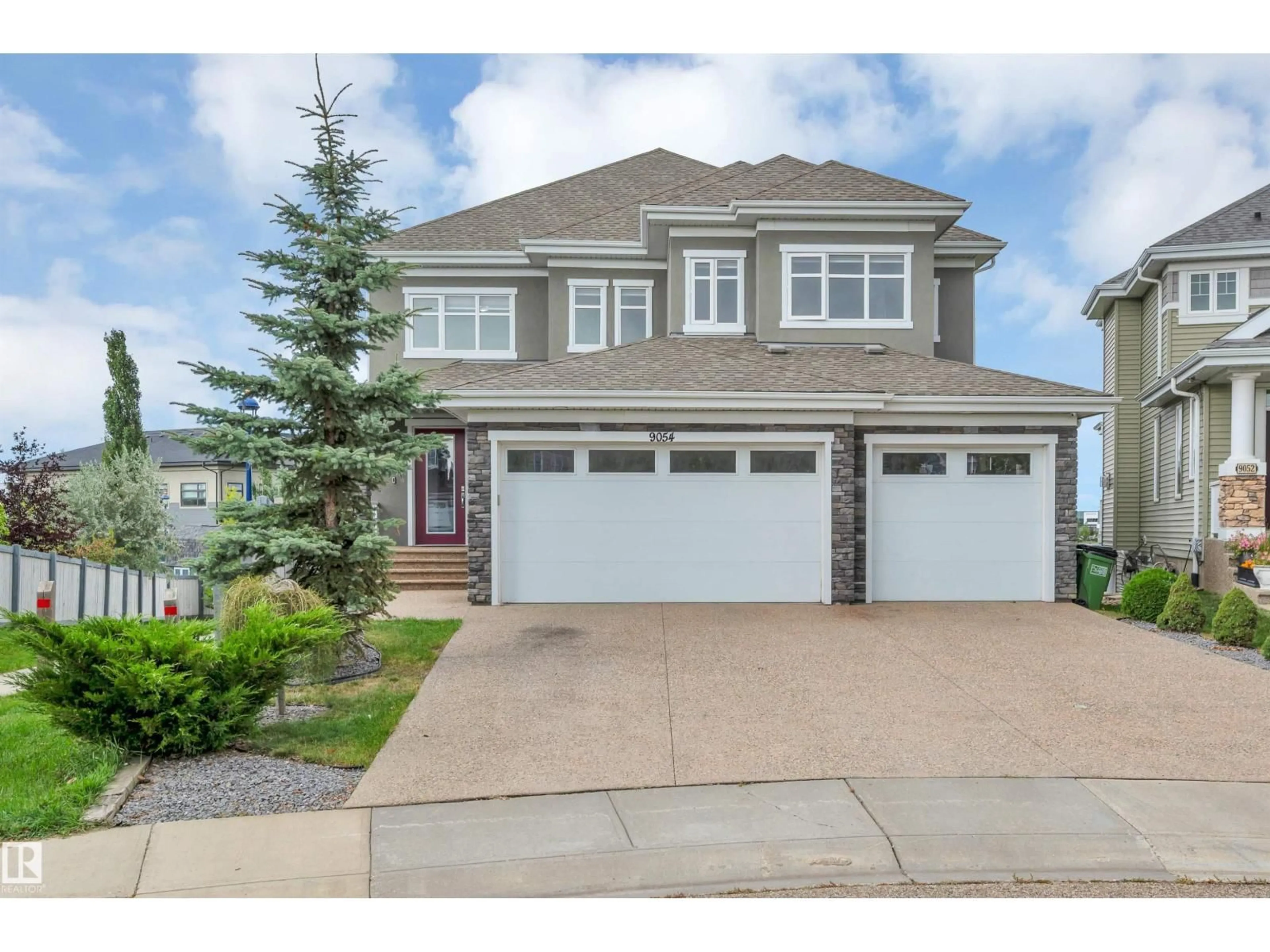 Home with vinyl exterior material, street for SW - 9054 24 AV, Edmonton Alberta T6X2C4