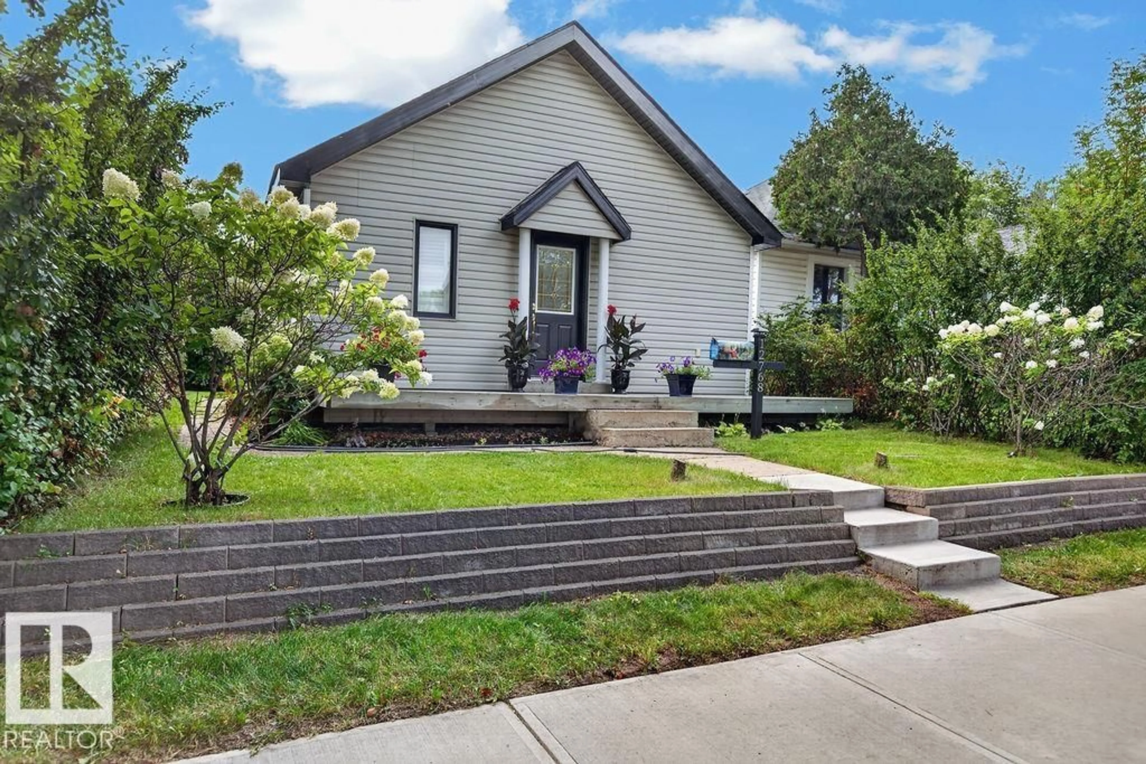 Home with vinyl exterior material, street for NW - 12768 118 ST, Edmonton Alberta T5E5K8