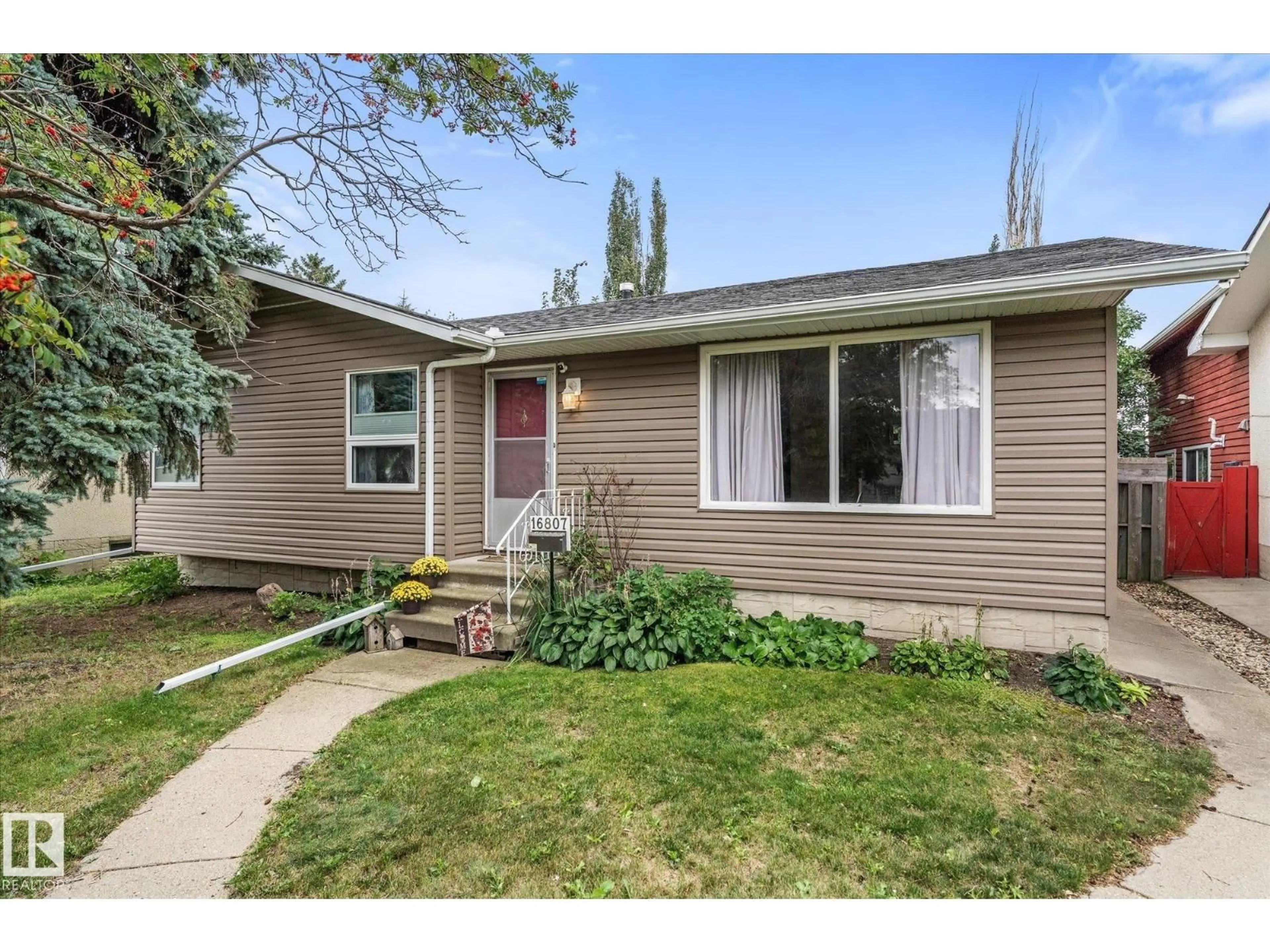 Home with vinyl exterior material, street for 16807 98 AVENUE NW, Edmonton Alberta T5P0G9