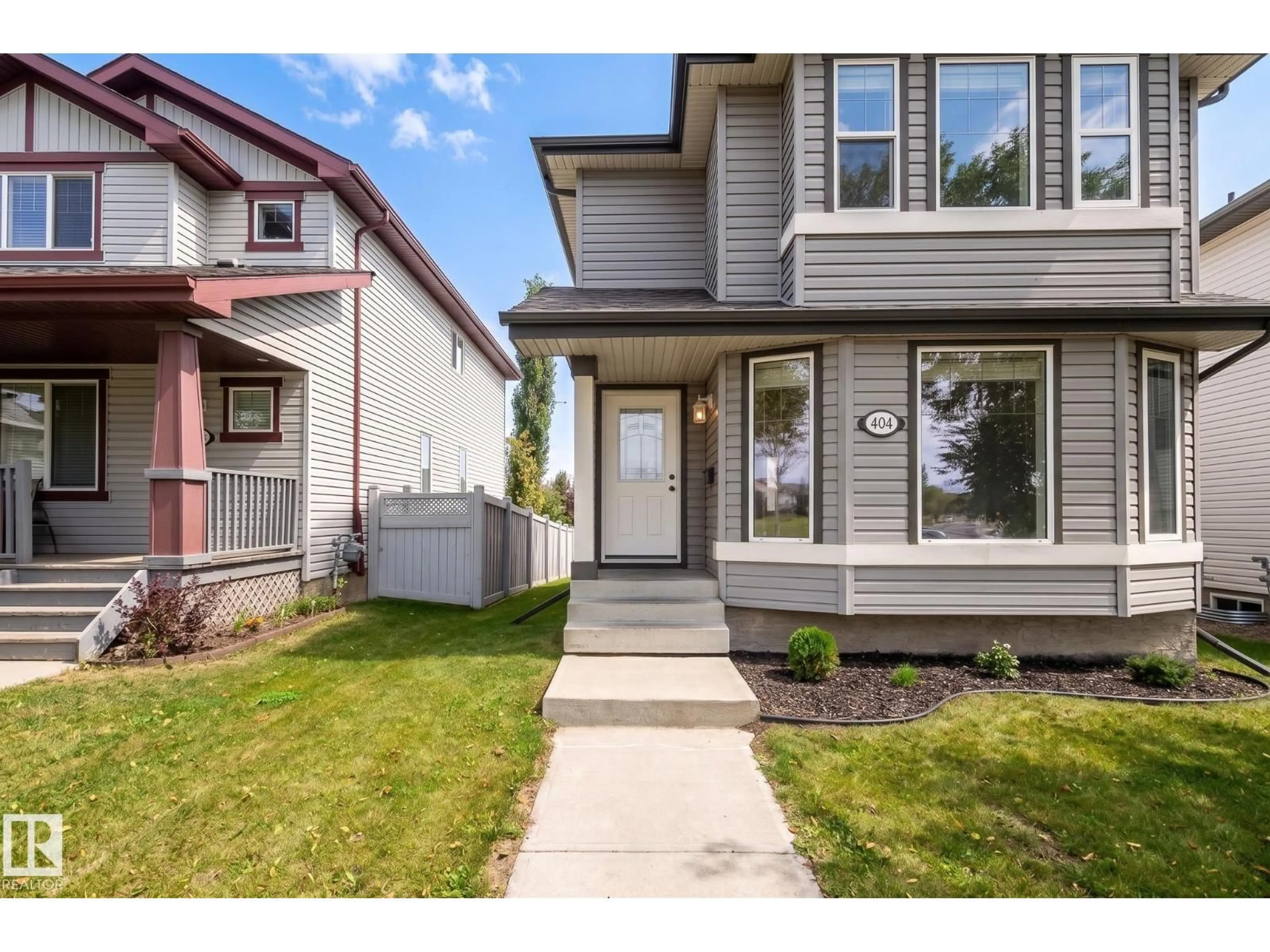 Home with vinyl exterior material, street for 404 HEMINGWAY RD, Edmonton Alberta T6M0J8
