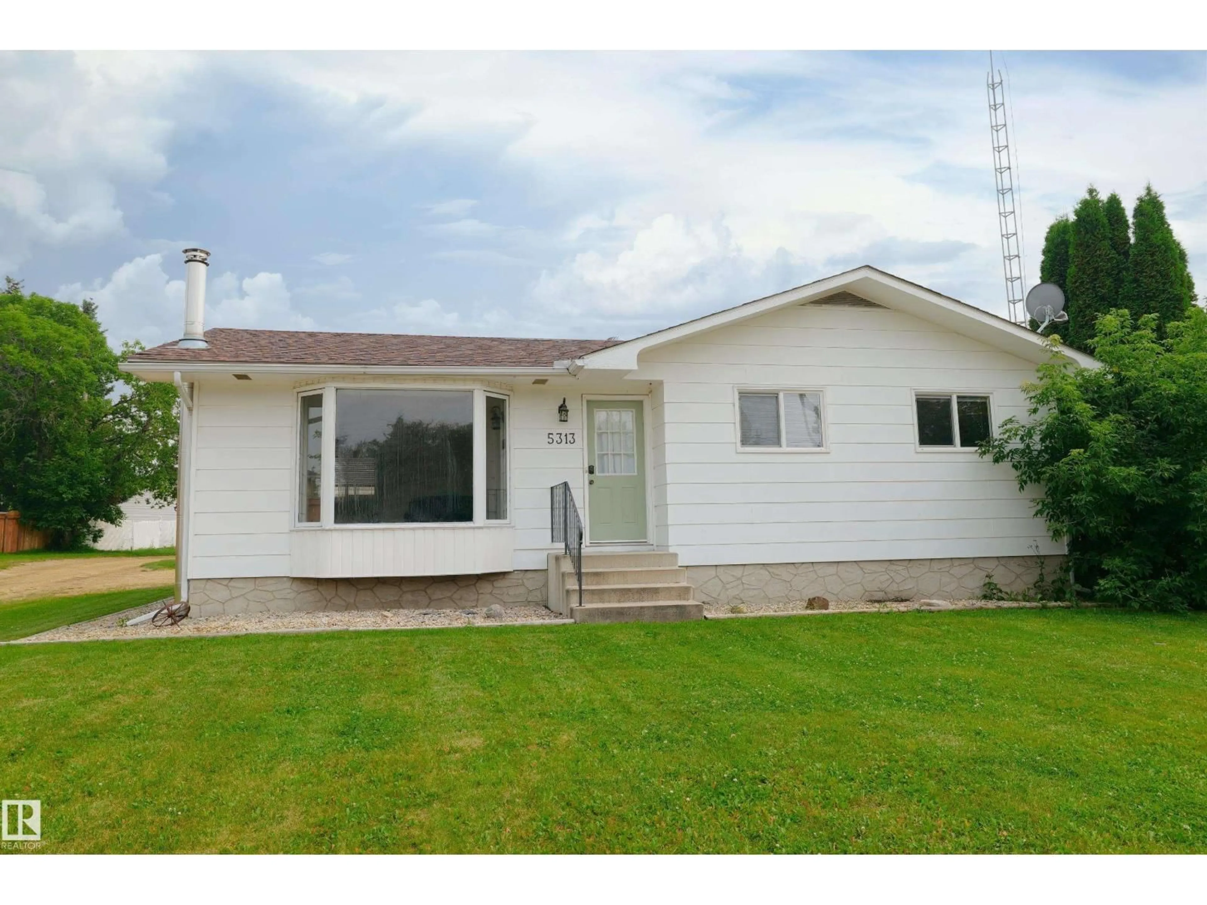 Home with vinyl exterior material, street for 5313 57 ST, Barrhead Alberta T7N1N4