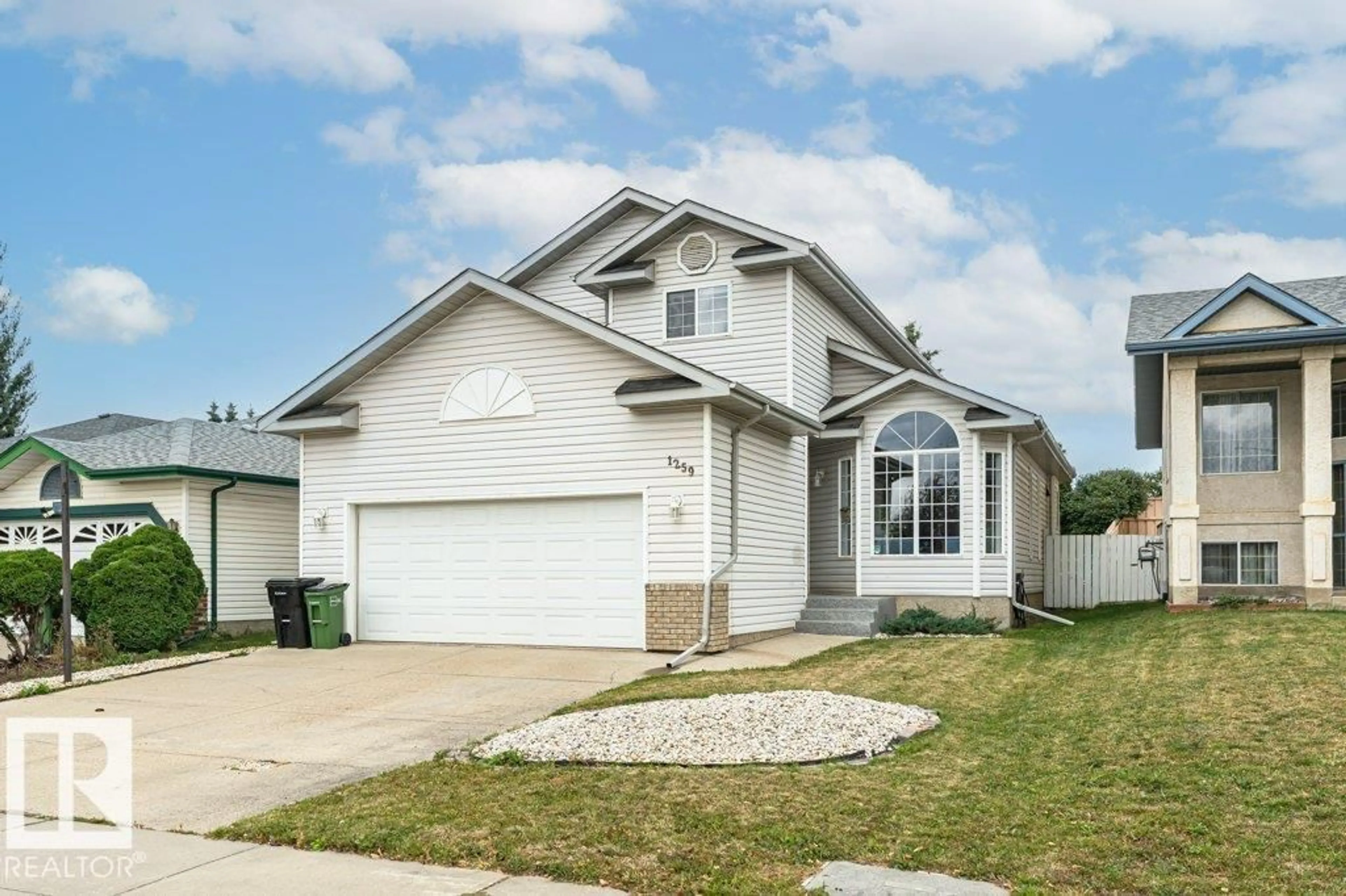 Home with vinyl exterior material, street for 1259 JOYCE CR, Edmonton Alberta T6L6V3