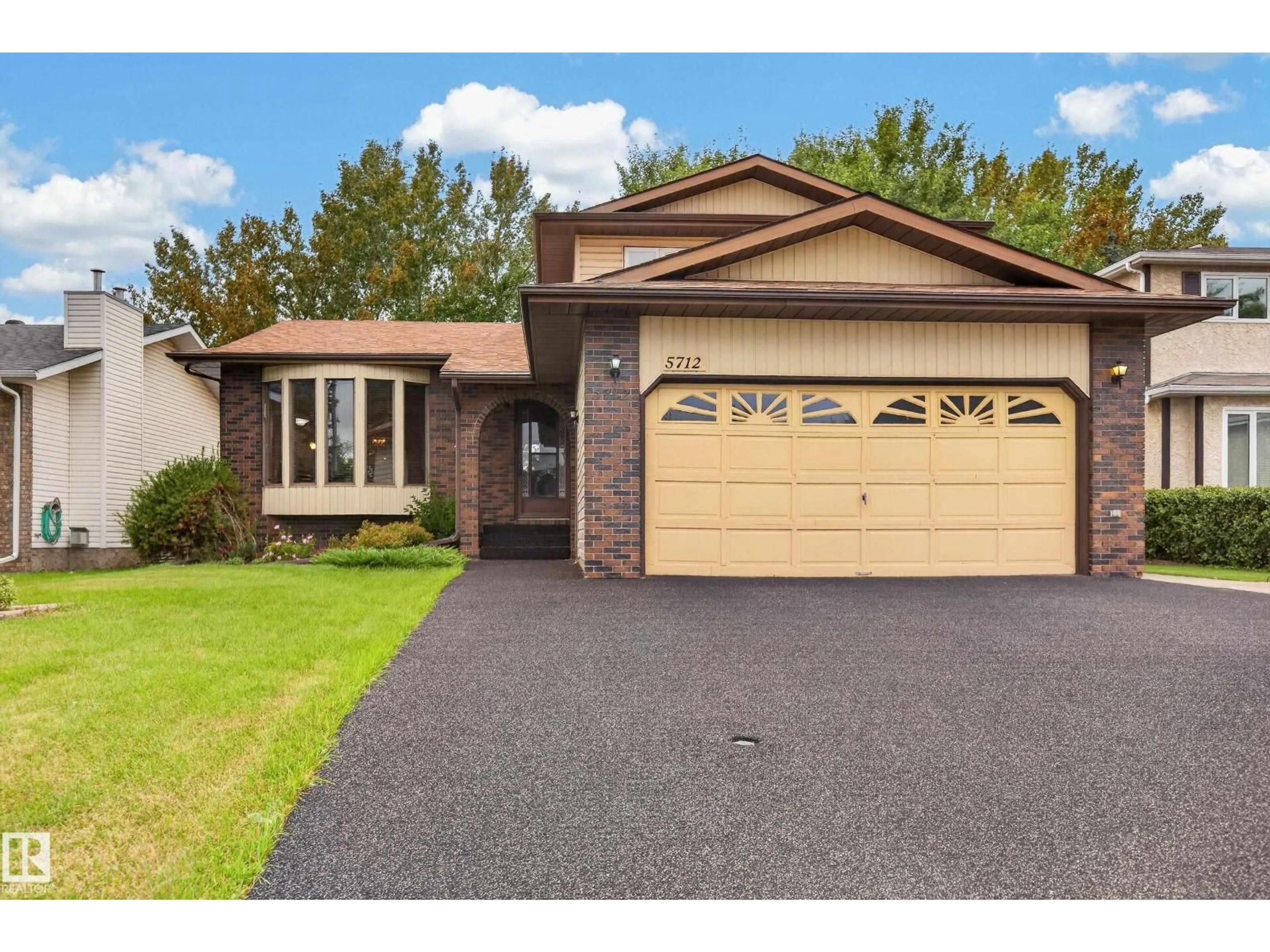 Home with brick exterior material, street for NW - 5712 123 AV, Edmonton Alberta T5W5G2
