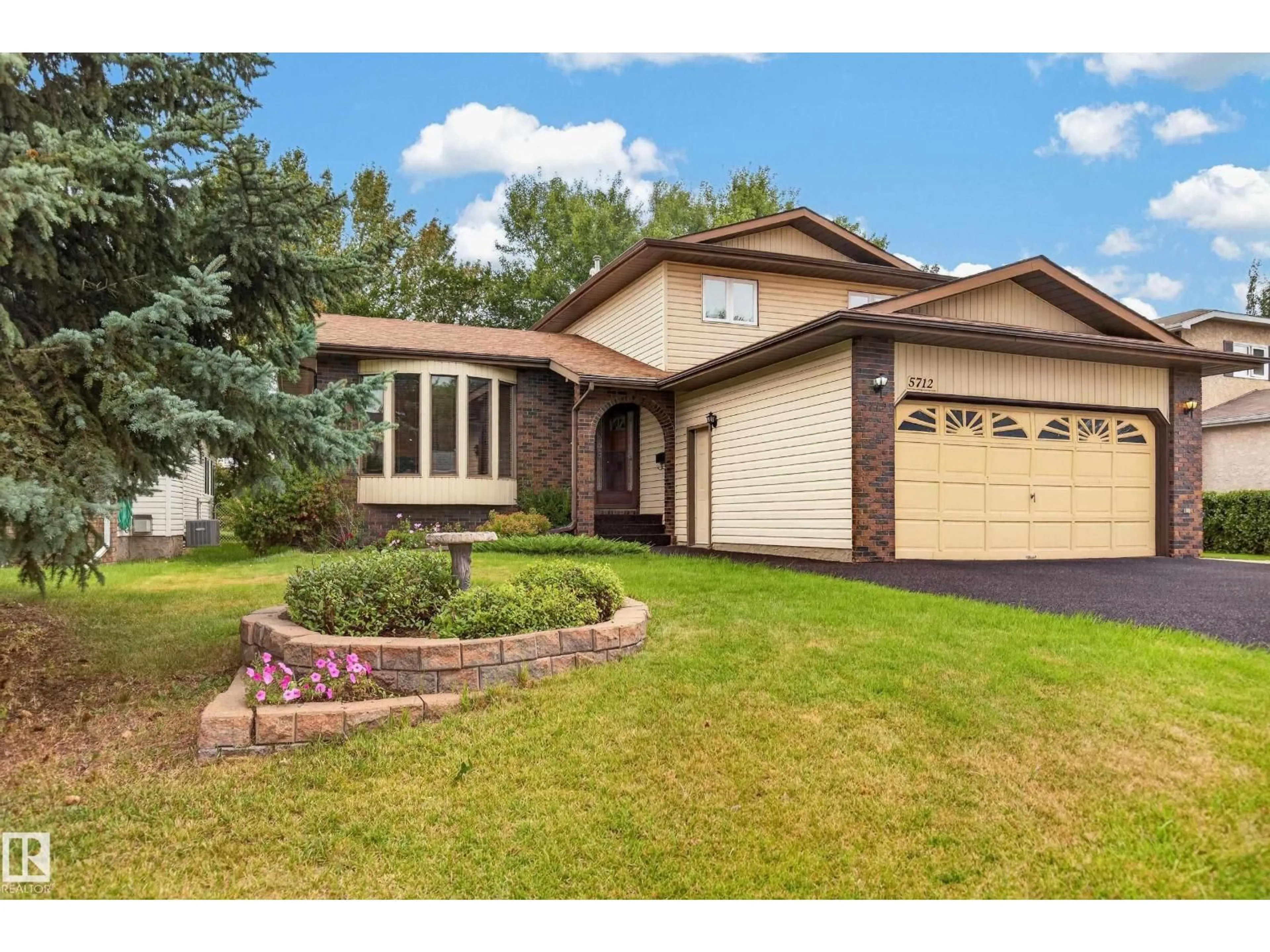 Home with vinyl exterior material, street for NW - 5712 123 AV, Edmonton Alberta T5W5G2