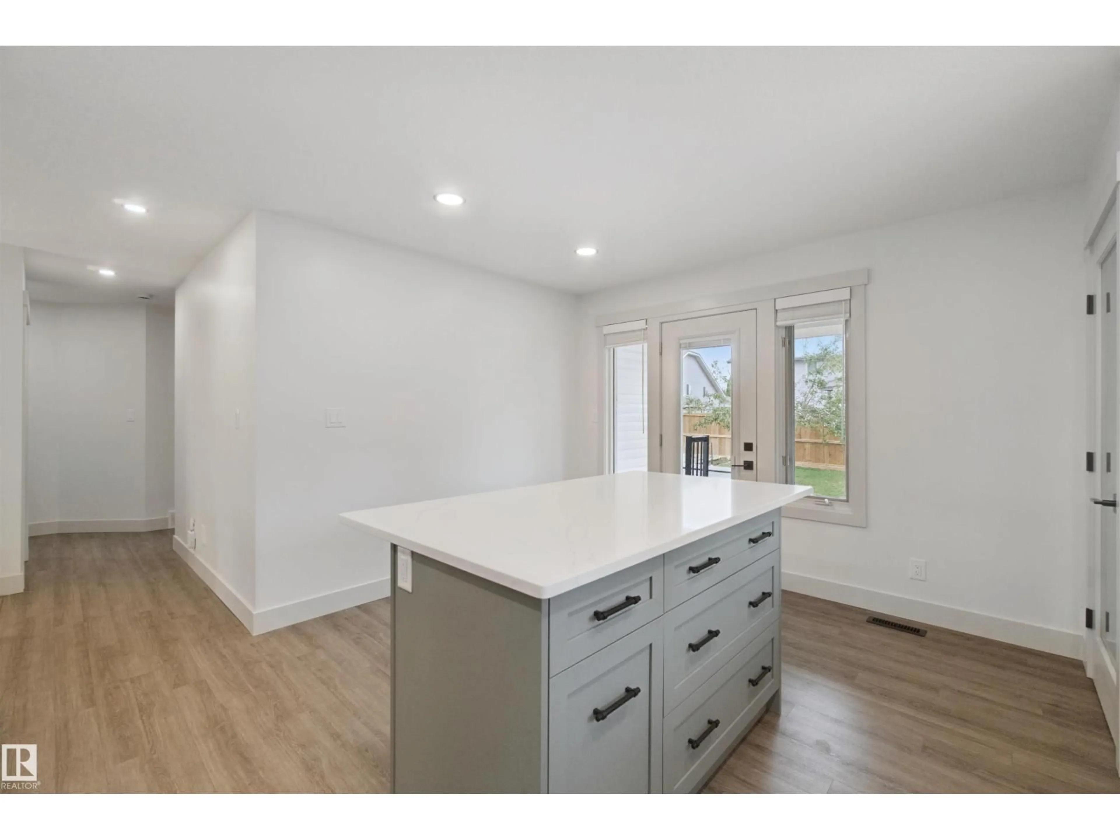 Open concept kitchen, wood/laminate floor for 46 GUENETTE CR, Spruce Grove Alberta T7X3G9