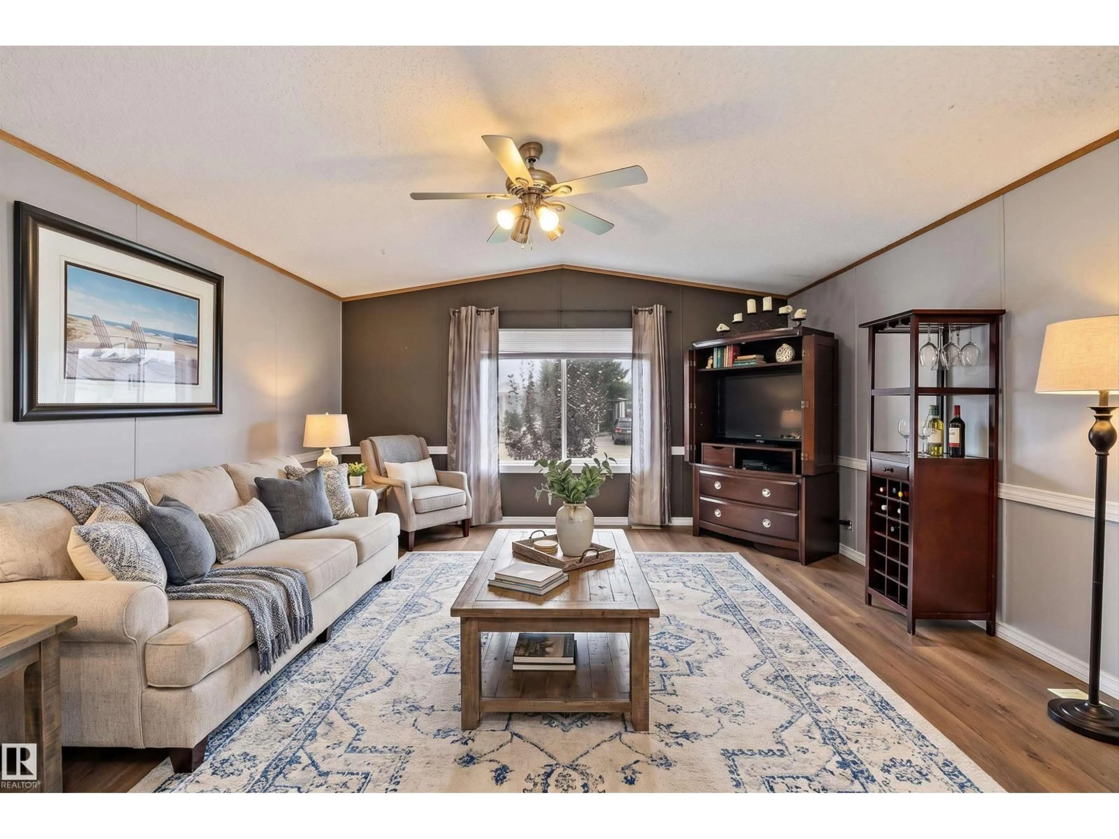 Living room with furniture, wood/laminate floor for 161 - 3400 48 ST, Stony Plain Alberta T7Z1R9
